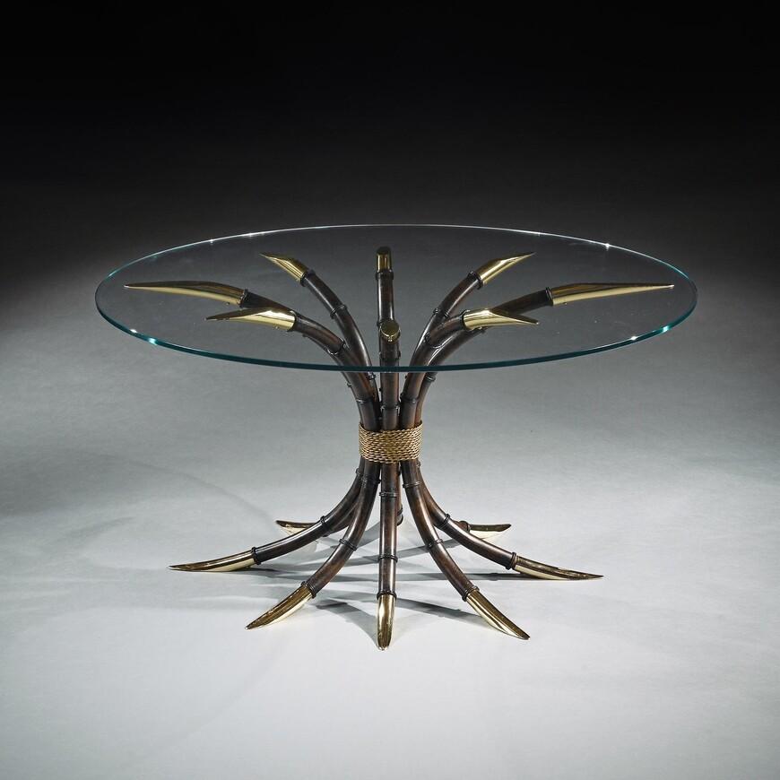 Stylish mid 20th Century Italian faux bamboo iron and brass plated centre / dining table with circular plate glass top.

Italy cira 1970’s-1980’s.

A very decorative and attractive wrought-iron centre or dining table designed as a cluster of in