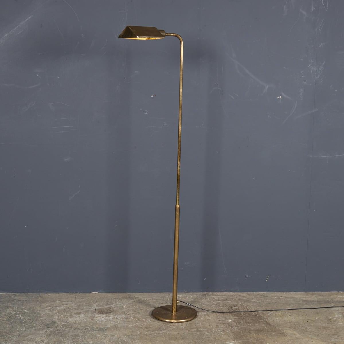 A Vintage mid 20th Century lamp crafted in Italy, featuring a brass stand, stem and curved shade, dating back to the 1950's. The shade accommodates modern day lightbulbs or smart bulbs, illuminating any space with grace. The stand is extendable and