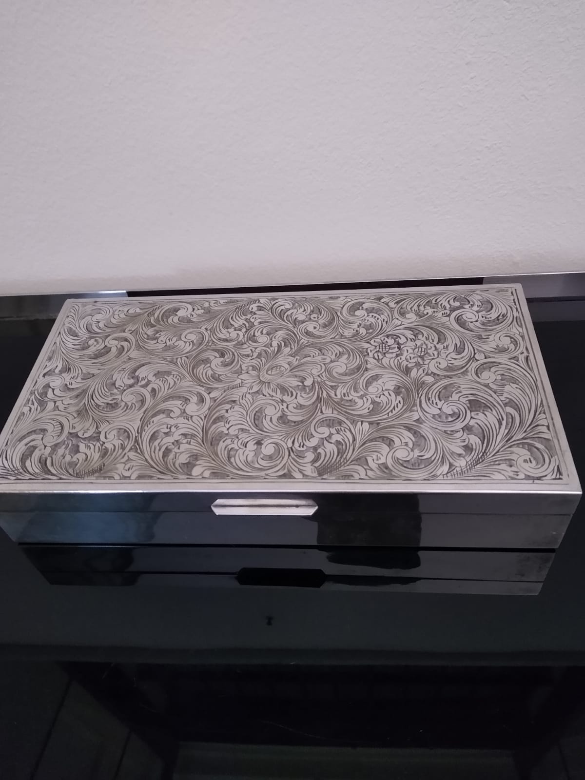 This mid-century decorative box displays the best of Italian craftmanship  The exterior features a textured Sterling silver 800 surface  reflecting the Italian meticulous attention to detail . The interior reveals a warm-toned wooden lining,