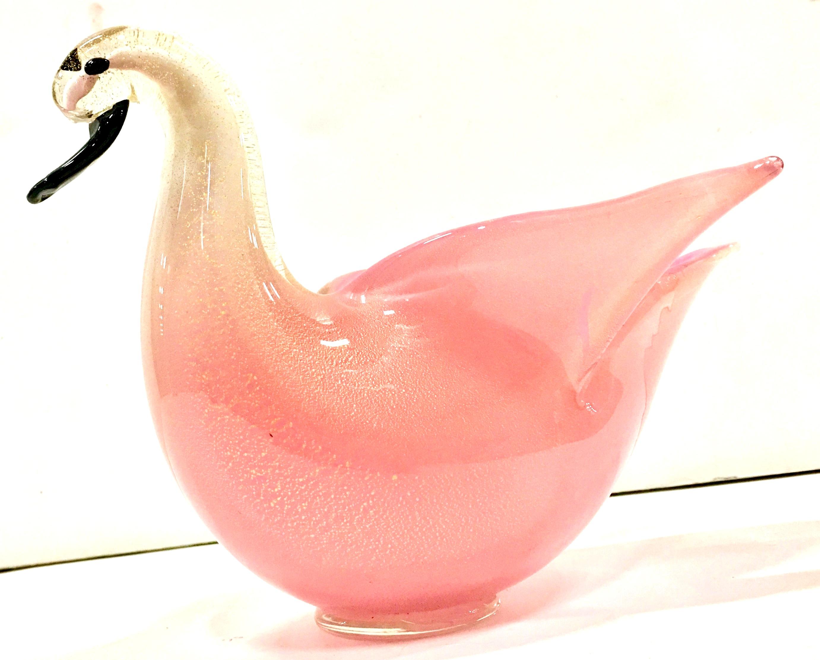 Mid-20th century coveted pink with gold flecks figural Italian Murano glass figural swan bowl. Features a pink body that fades to white and clear. The swan head details are finished in black. Gold fleck detail throughout.