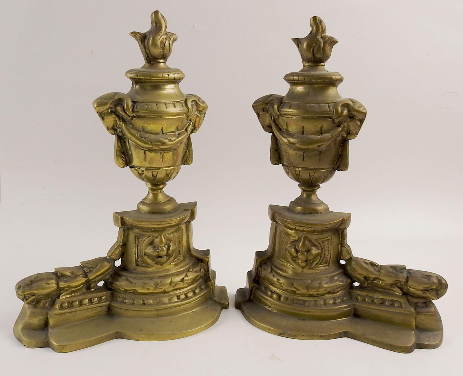 Pair of vintage mid 20th century neoclassical  brass chenets.  Stamped Made Italy on bottom.  Soft overall patina.