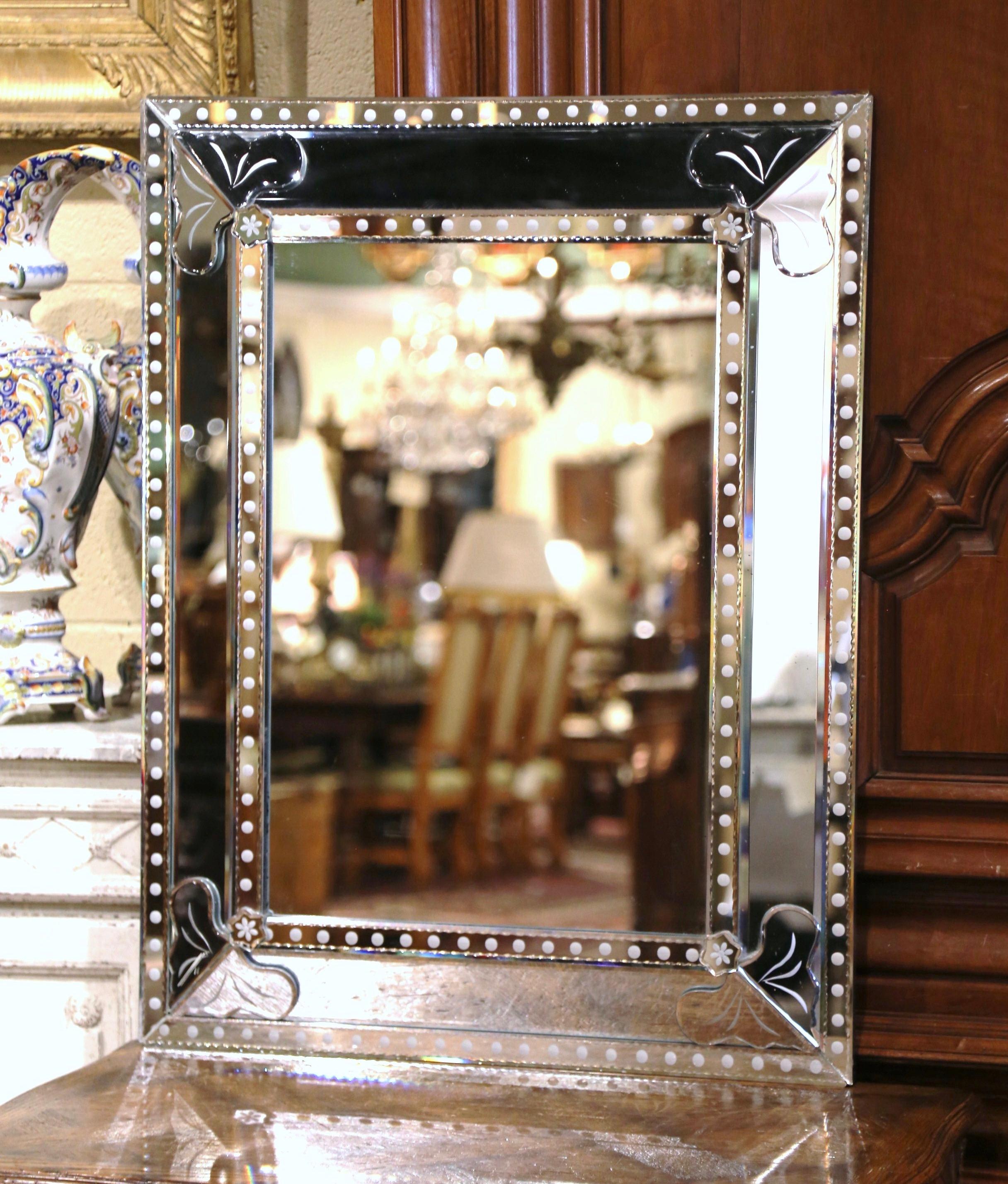 Decorate a powder room or a bedroom with this elegant, antique Venetian mirror from Italy. Crafted circa 1950 and rectangular in shape, the large overlay mirror features acanthus leaf decor in each corner, embellished with floral rosettes. Each