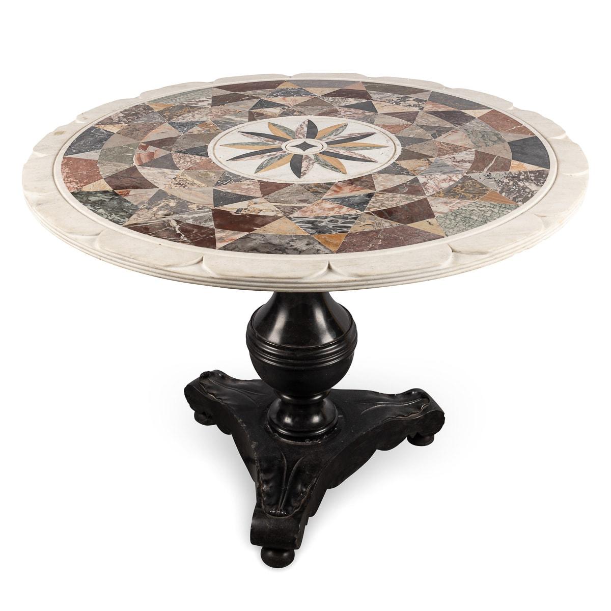 A mid-20th Century Italian Pietra Dura marble occasional table. Elegantly made with a range of different geometric cut marble inserts. The table features a beveled edge and petal shaped lip on the tabletop. The base, made out of ebonised wood is