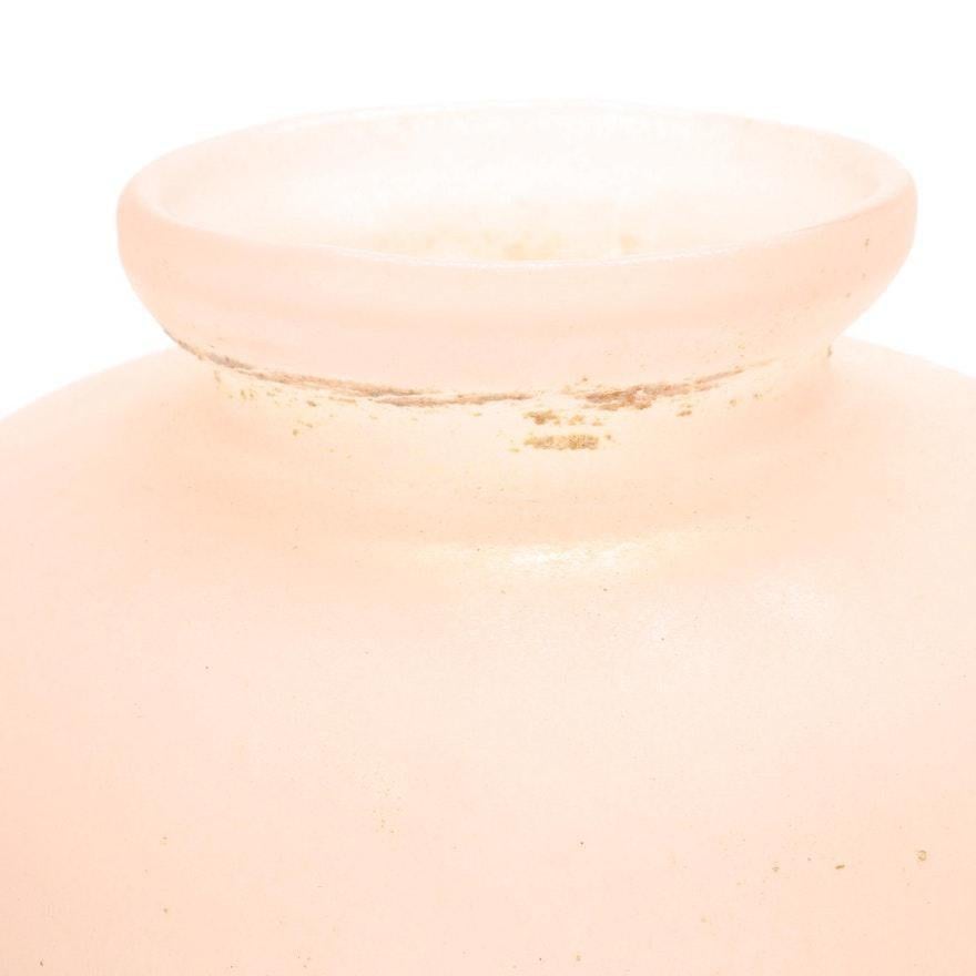 A mid 20th century Roman style pink Scavo glass vase. Scavo glass was created in the mid 20th century by using a technique involving the application, to the surface of an object, of substances that, when heated to about 1470°F (800°C), fuse and