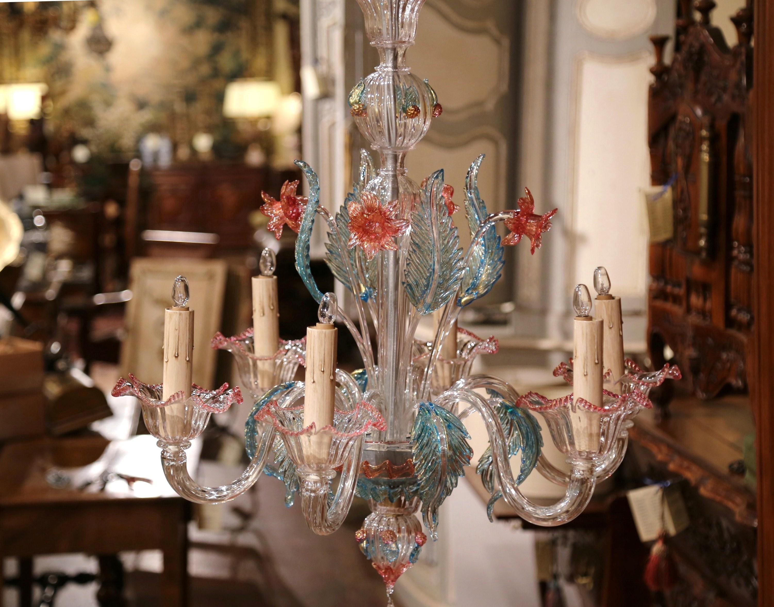 Decorate an entry or a bedroom with this colorful Murano glass chandelier, crafted in Italy circa 1960, the light fixture features six newly wired arms with pink painted edges bobeches, and decorated with blown glass acanthus leaves in the pale blue