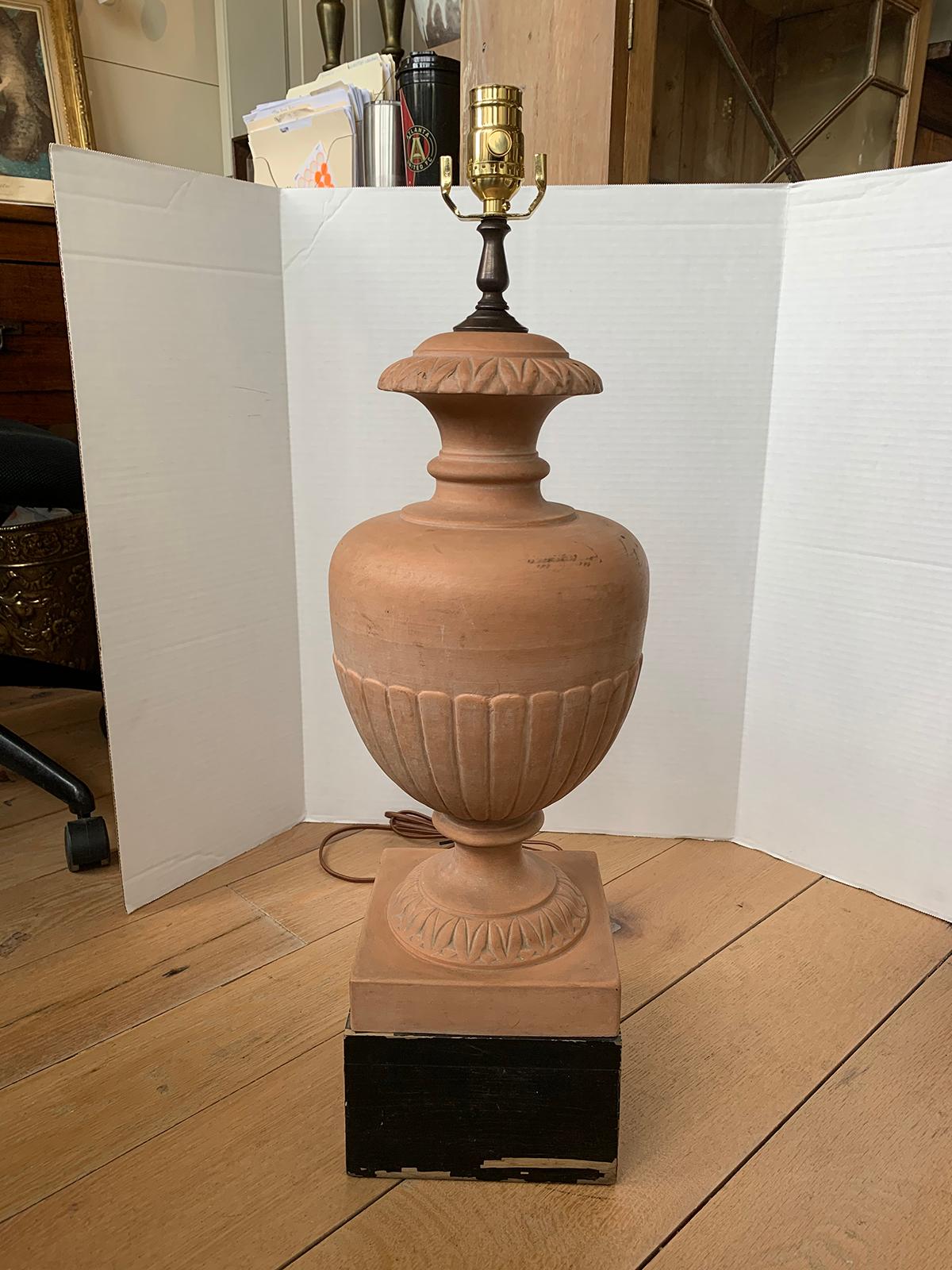 Mid-20th century Italian terracotta urn as lamp with painted black wood base
new wiring.