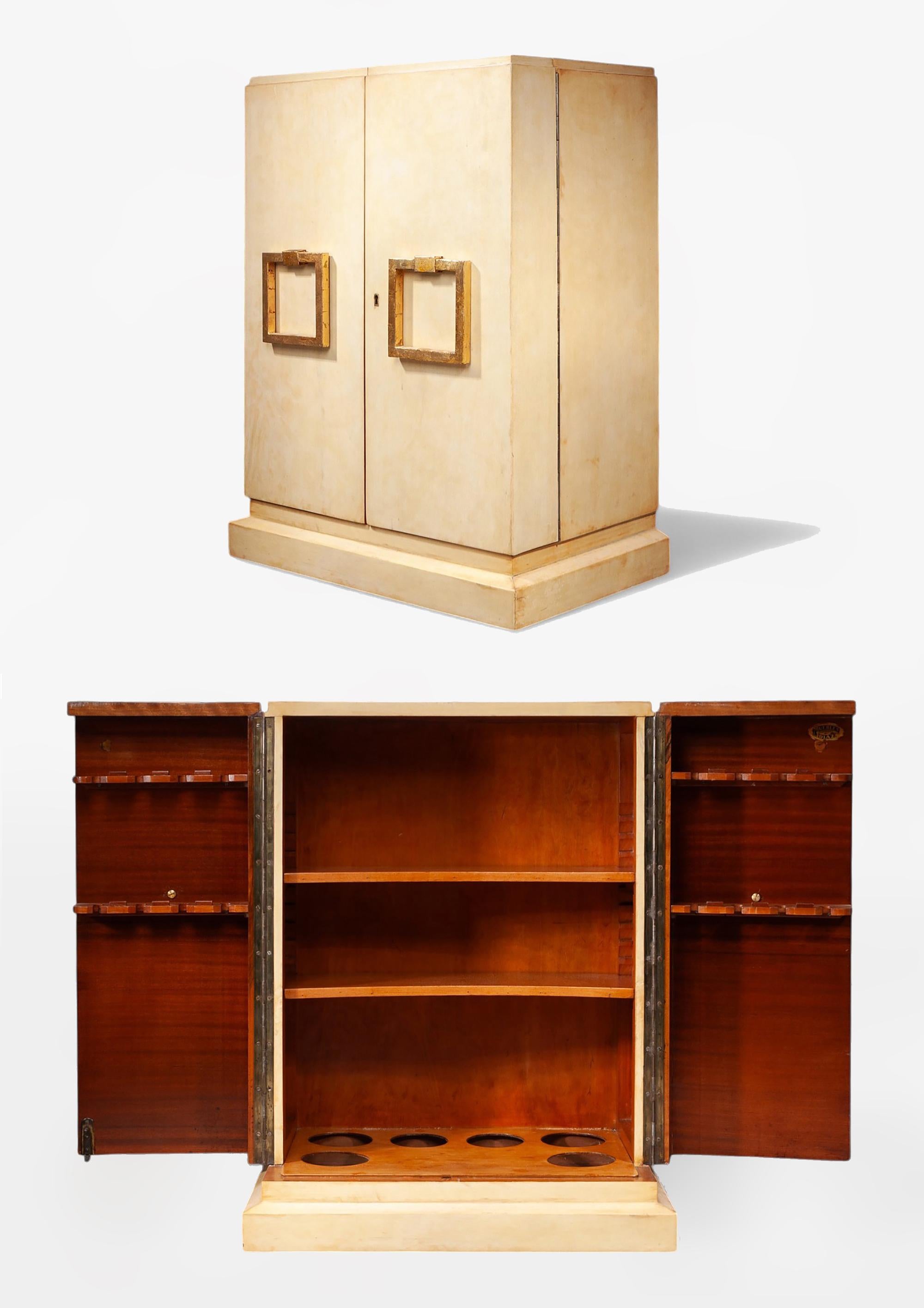 Mid-20th century Modern parchment-covered wood dry bar storage cabinet in the style of Jean-Charles Moreux, France

By: Jean-Charles Moreux (in the style of)
Material: wood, parchment paper, metal
Technique: cast, molded, carved,