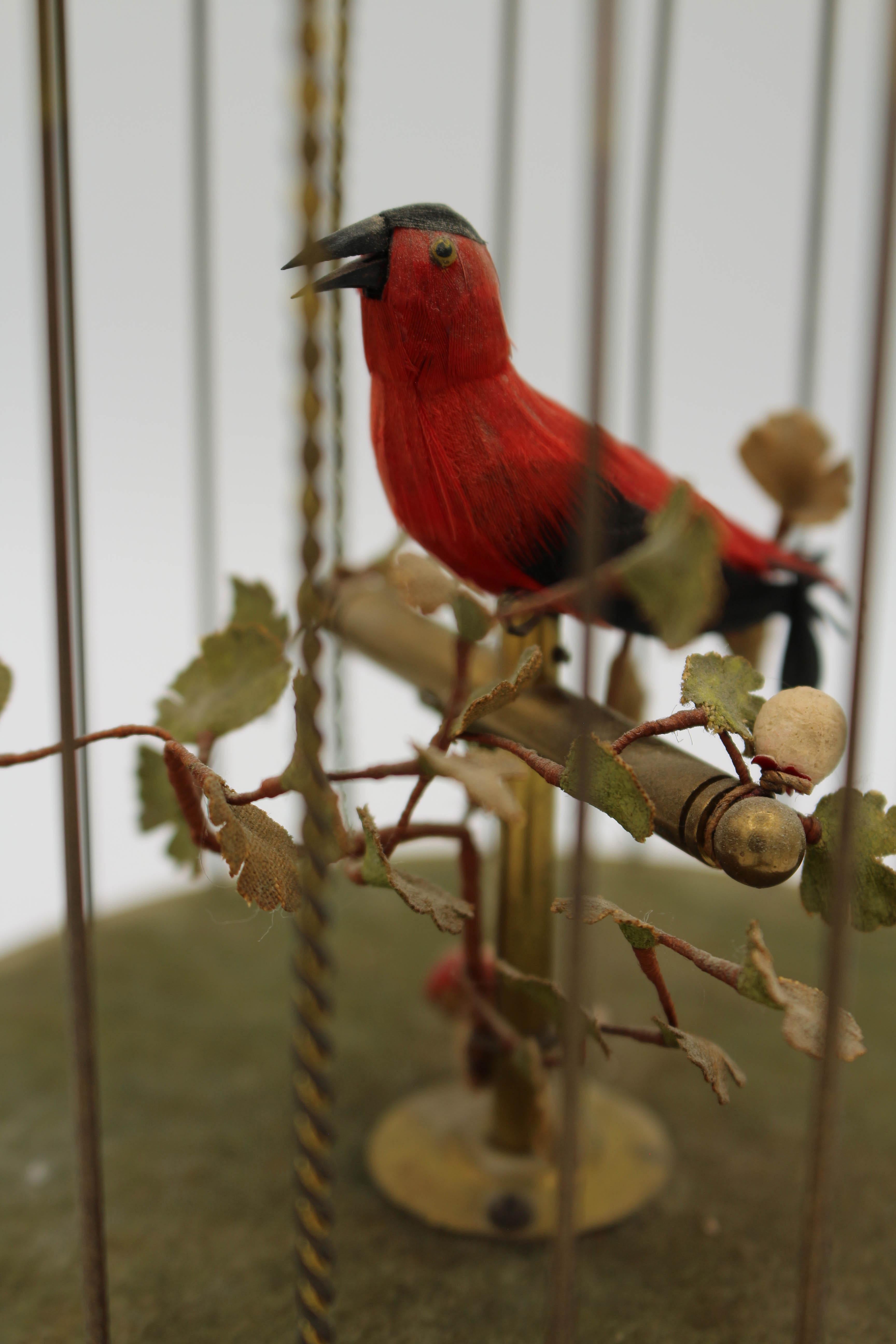 Mid-20th century Automaton signing bird in cage music box by Karl Griesbaum. Made in Germany, working condition. 12 1/4