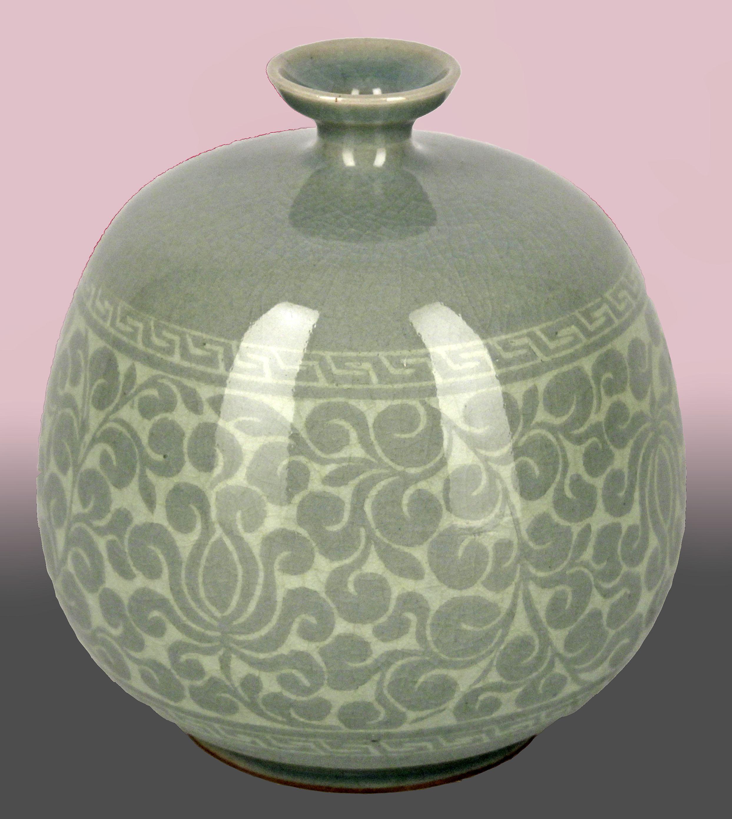 Mid-20th century korean hand-crafted ceramic celadon vase with lotus decoration

By: unknown
Material: ceramic, celadon, enamel
Technique: molded, pressed, glazed, polished, enameled, hand-crafted
Dimensions: 5 in x 5 in
Date: mid-20th