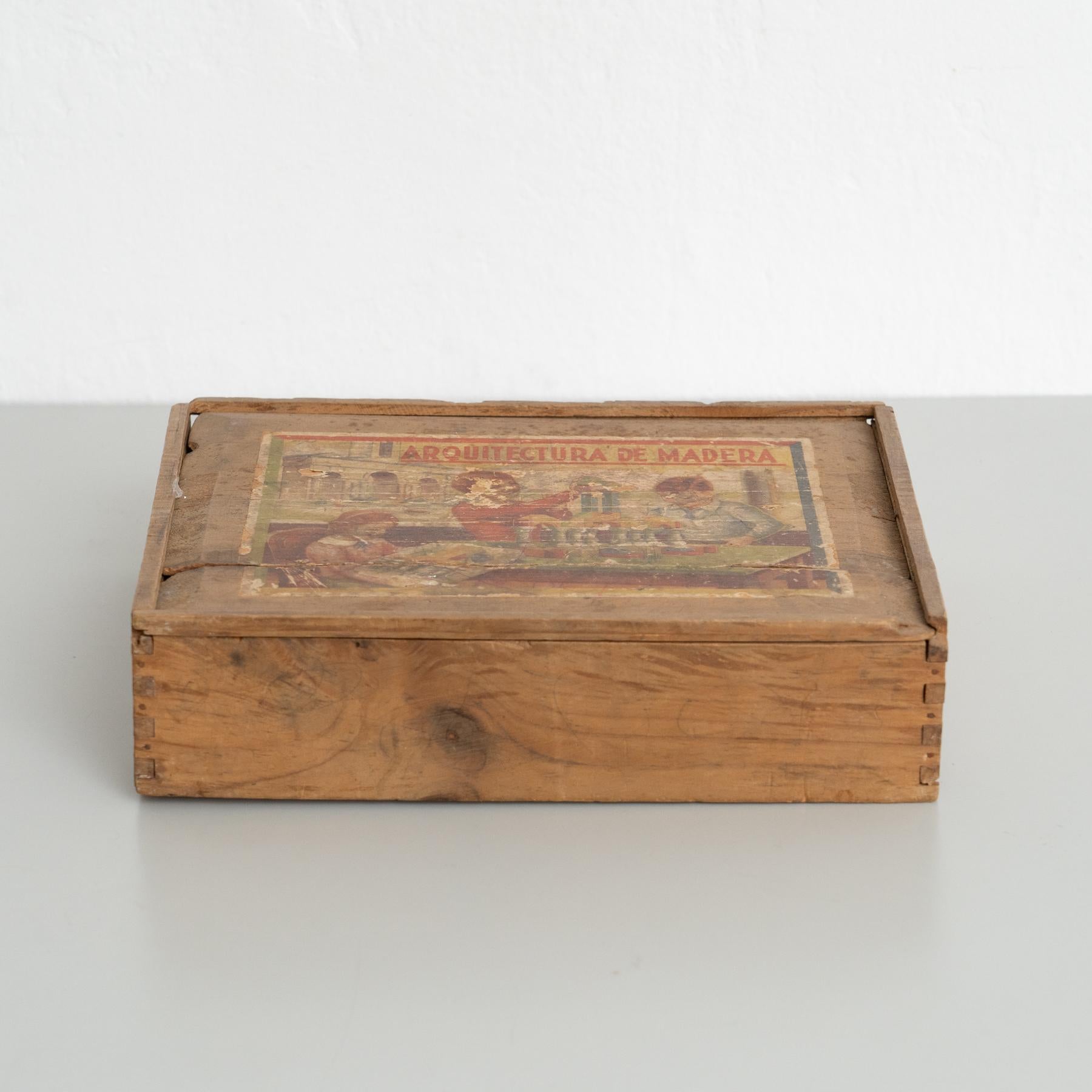 This rare mid-20th-century architectural construction set, crafted in Spain, is a nostalgic piece that showcases the charm of traditional wooden toys. The set features lacquered wooden pieces, beautifully designed and preserved, offering a glimpse