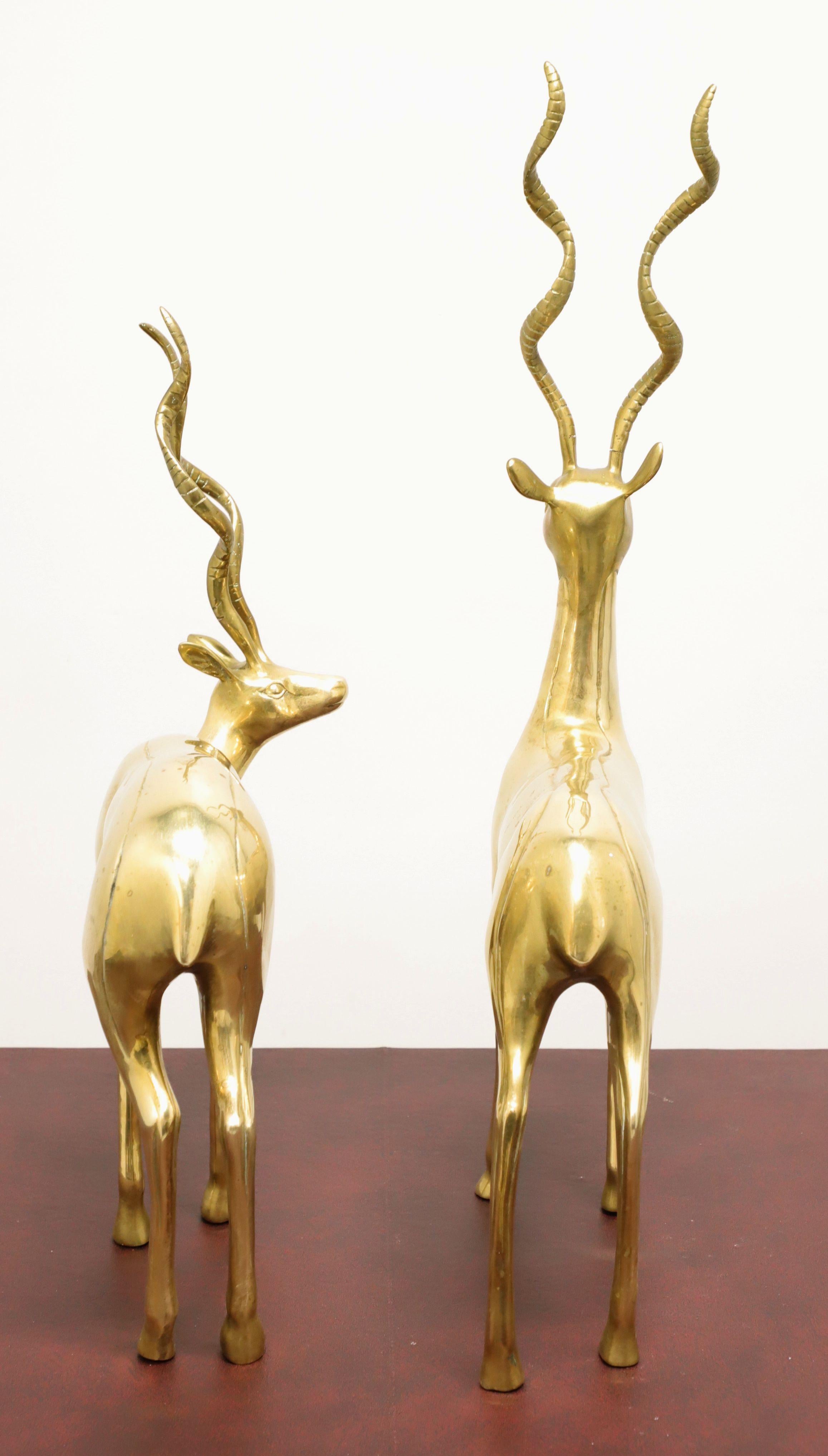 American Mid 20th Century Large Brass Standing Antelope Sculptures - Pair For Sale