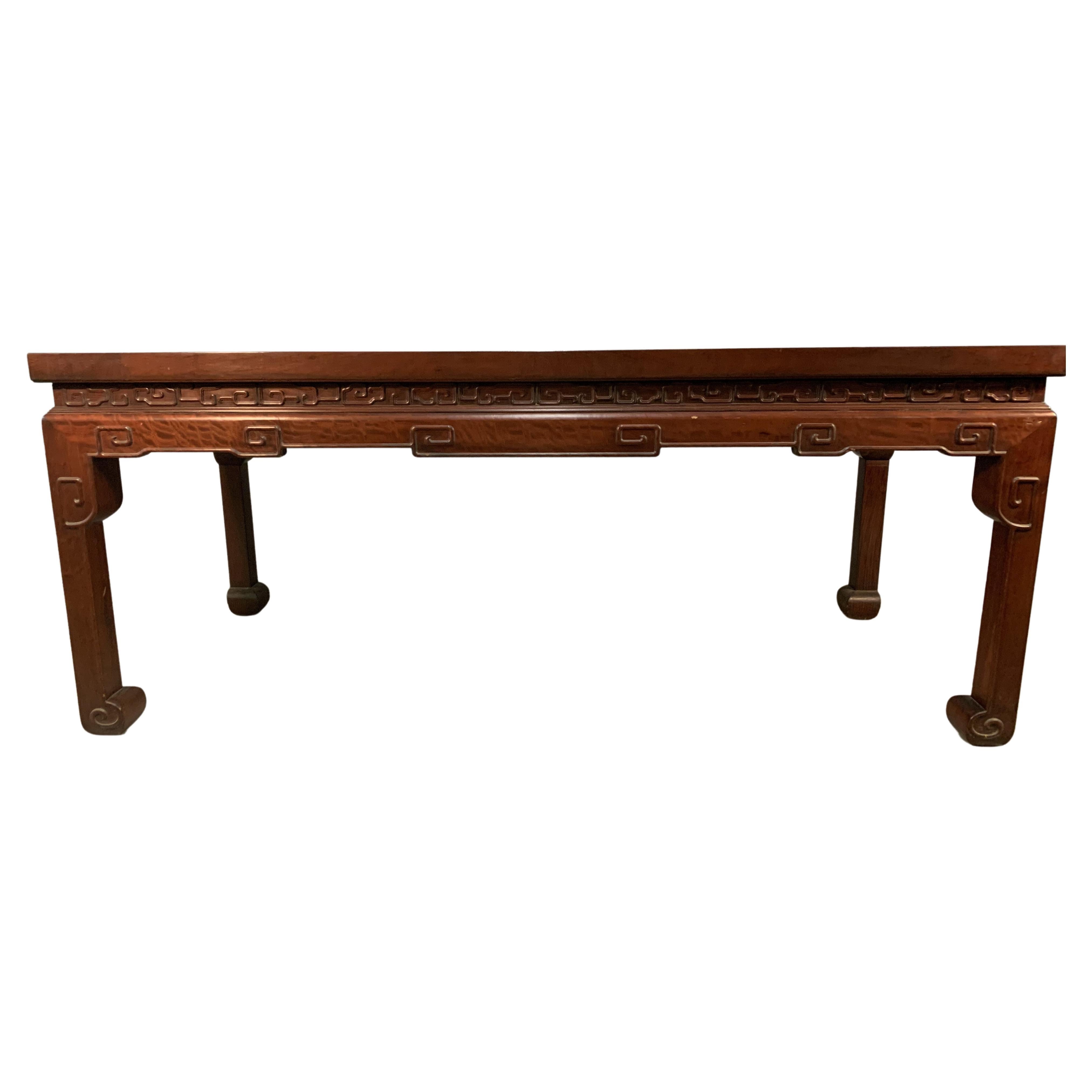 An exceptional carved rosewood center table in the Ming style in large old timber from the mid 20th century. This piece is very high quality and style. 
It would easily work with European antiques as well as in a contemporary setting. 
This table