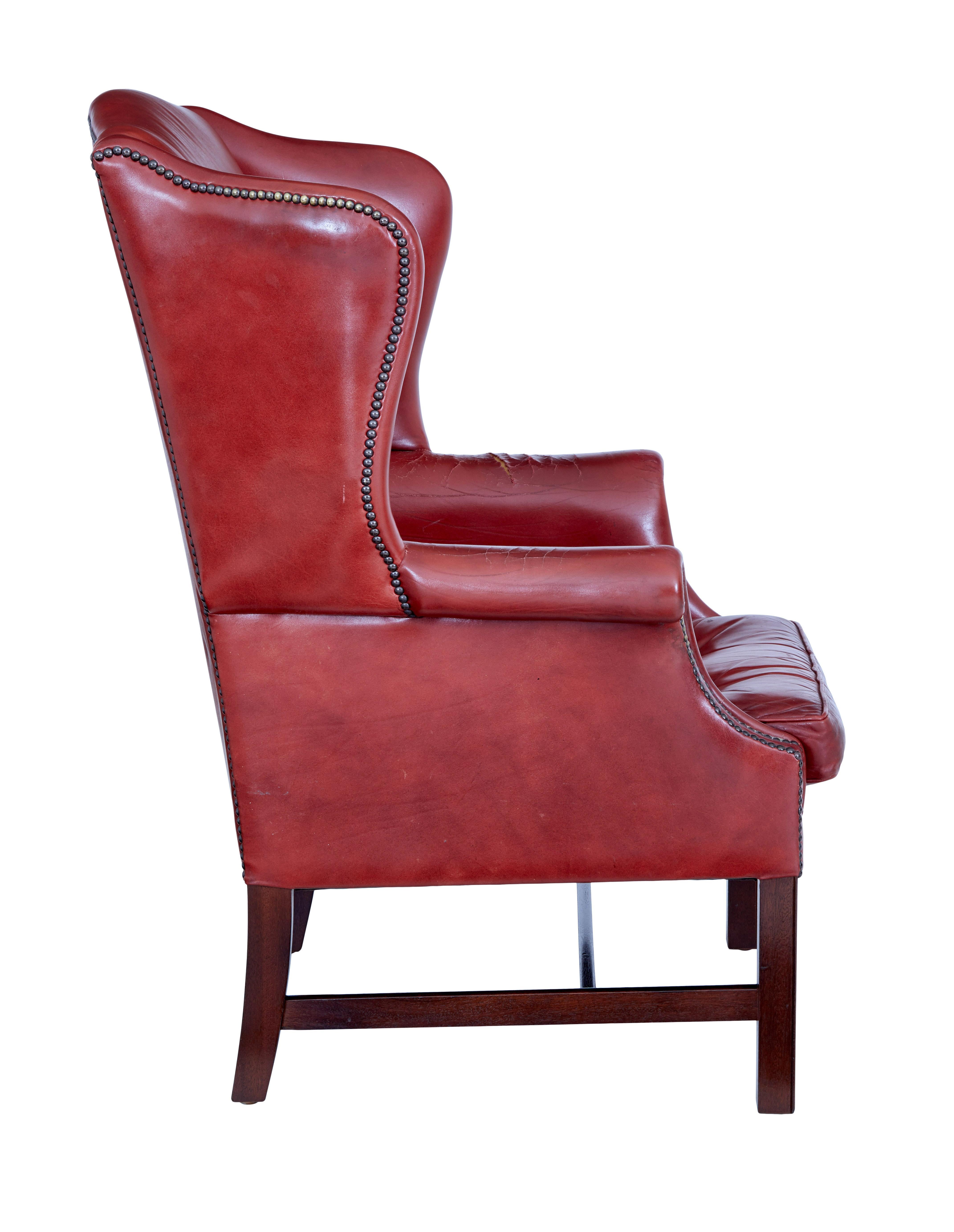 Georgian Mid 20th century leather wingback armchair For Sale