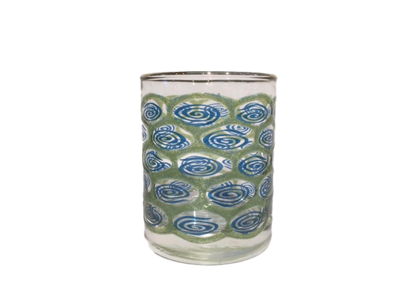 Mid-Century Modern barware by Libbey Glass Co - Set of six rocks glasses with gilded rims and raised translucent green enamel surrounding ovals containing translucent blue enamel swirls evoking water. All In excellent condition.