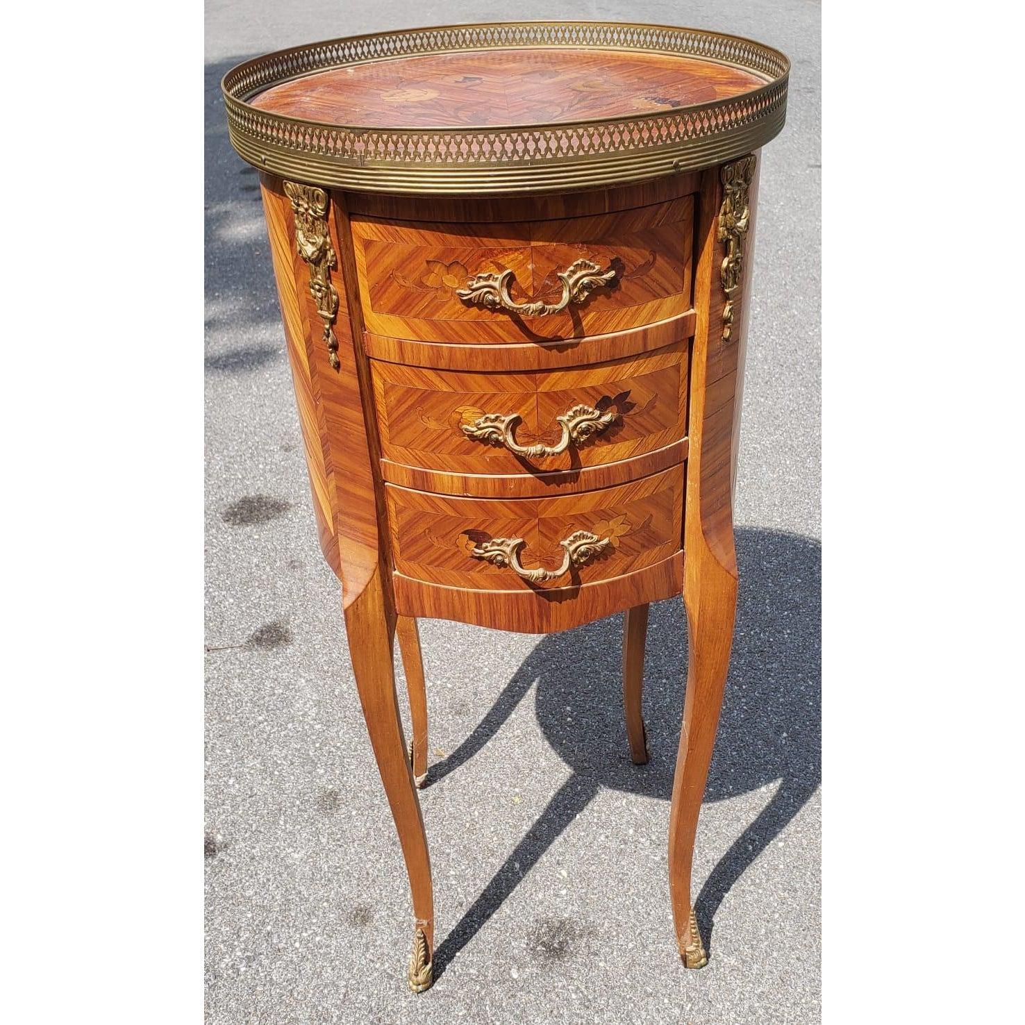 Mid 20th Century Petite Marquetry Louis XV side table with Ormolu Gallery.
This exquisite table is excellent condition. It features tons of Marquetry inlays all over. It also feature a galley of Ormolu ornaments on sides and legs with unique drawer