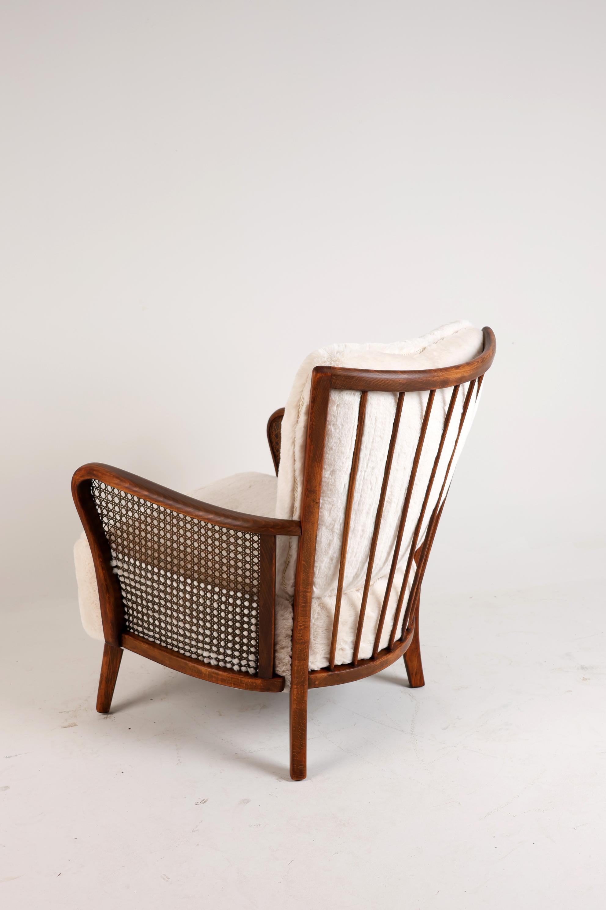 Oiled Mid 20th Century Lounge Chair in Rattan For Sale