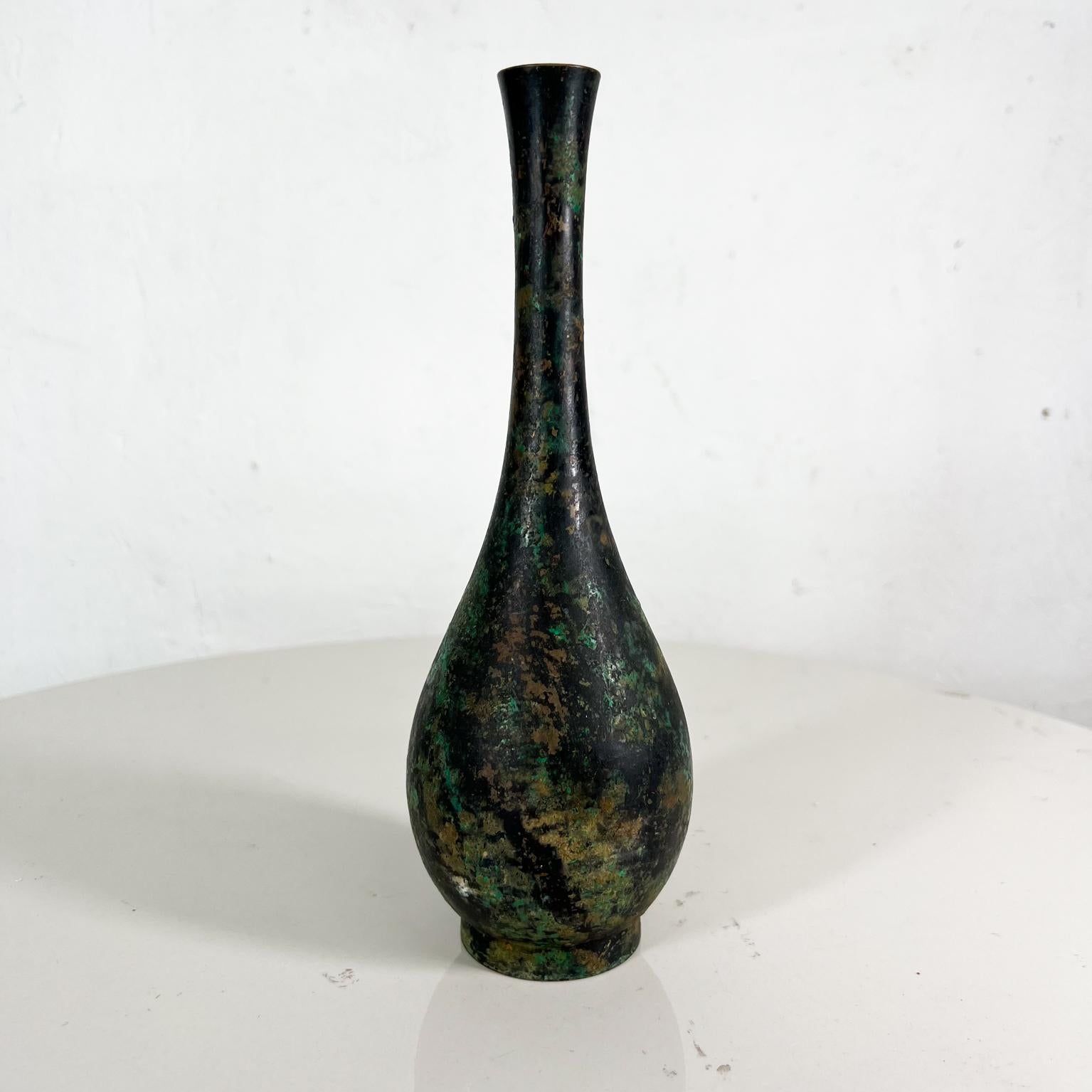 Mid-20th century lovely Japanese iron vase patinated vintage.

Vintage elegance classic Japanese vase iron patinated finish
Green, black and brown tones.
No stamp present. Japanese attribution.
Measures: 9 tall x 3 in diameter
Preowned