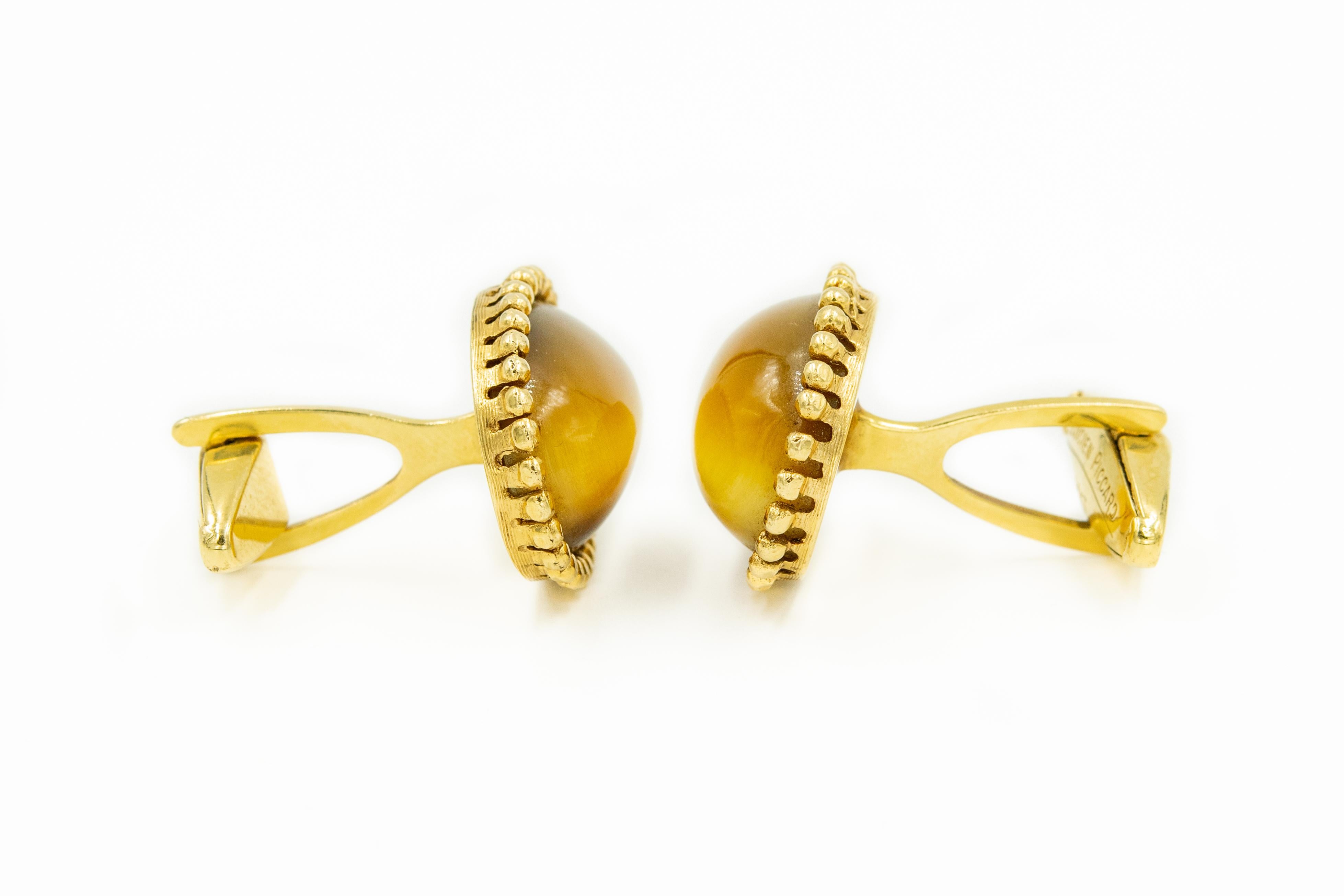 Mid 20th century Lucien Piccard  14K yellow gold cufflinks featuring oval tiger's eye quartz cabochons in beaded gold frame and toggle closures. 

Full depth including toggle is 1.04