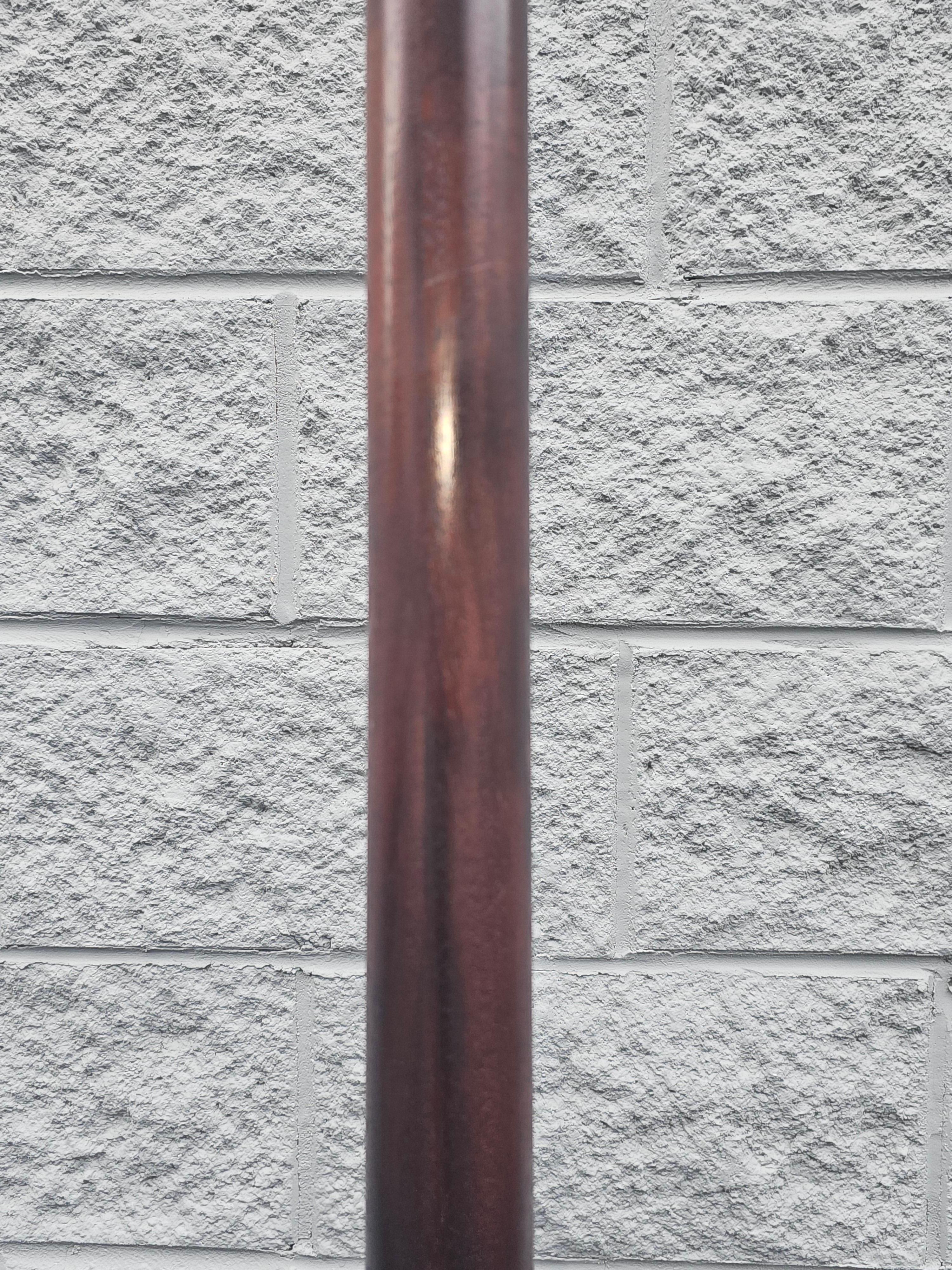 A Mid-20th Century Mahogany and Brass Inset Dual Lights Floor Lamp measuring 13.5