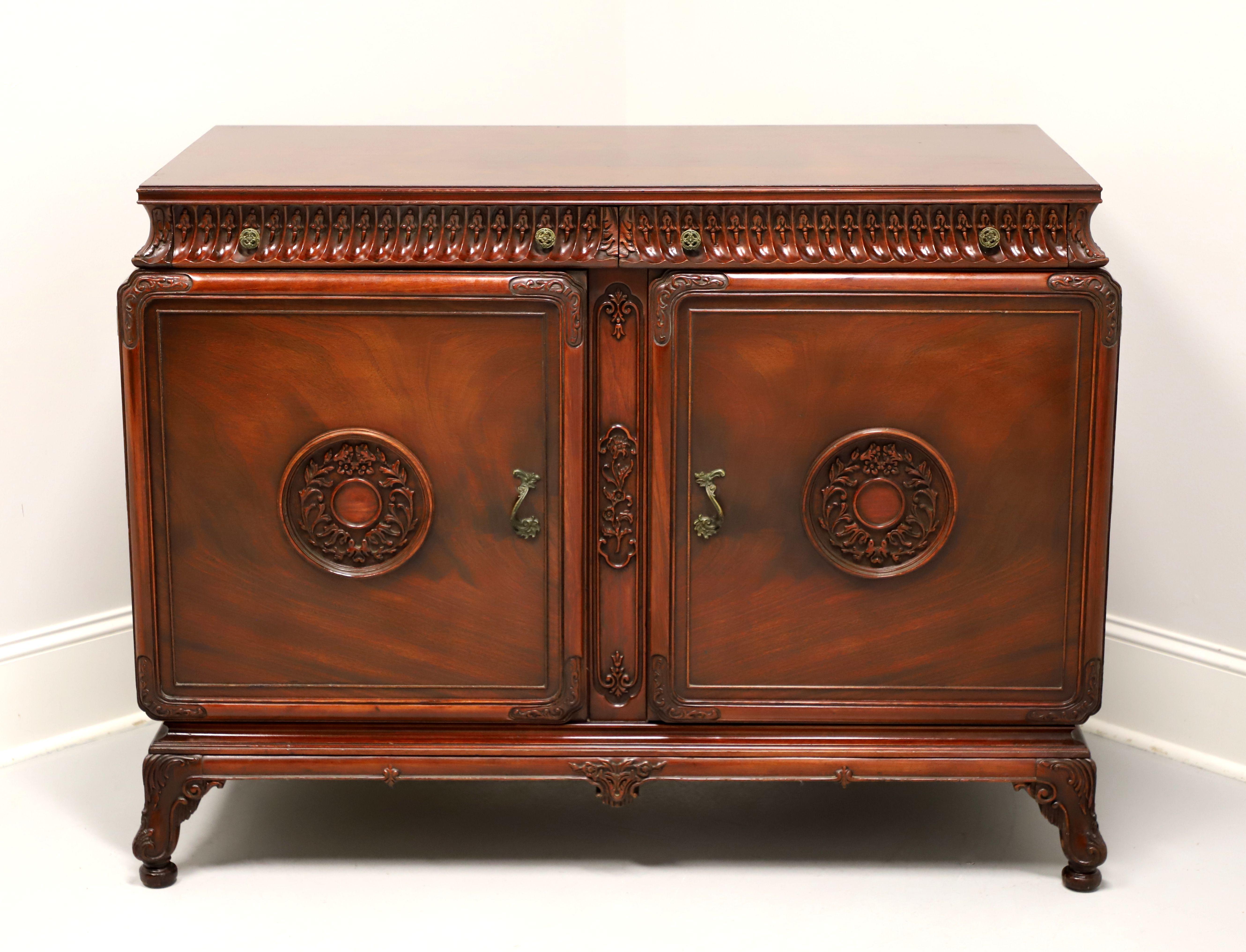 An Asian influenced double dresser, unbranded, similar quality to Kindel or Rway. Mahogany with flame mahogany door fronts & top, ogee edge to top, decorative brass hardware, distinctive Asian styling, intricately carved top drawers & sides under