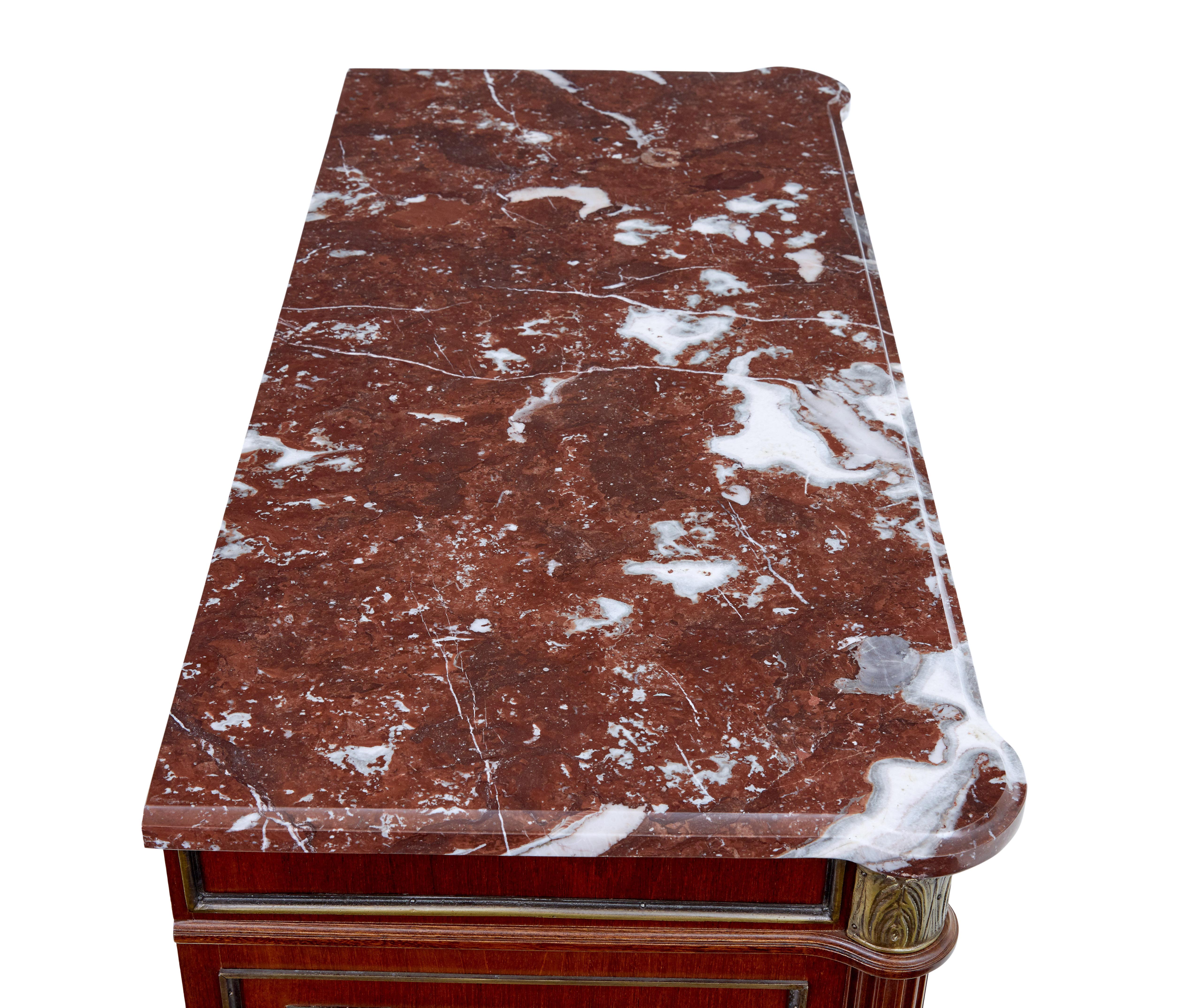 Mid 20th century mahogany marble top commode circa 1960.

Good quality chest of drawers in the rococo taste

Beautiful red and white marble top which is loose fitted.  Single drawer below the top surface with 2 ring handles, brass moulding and a