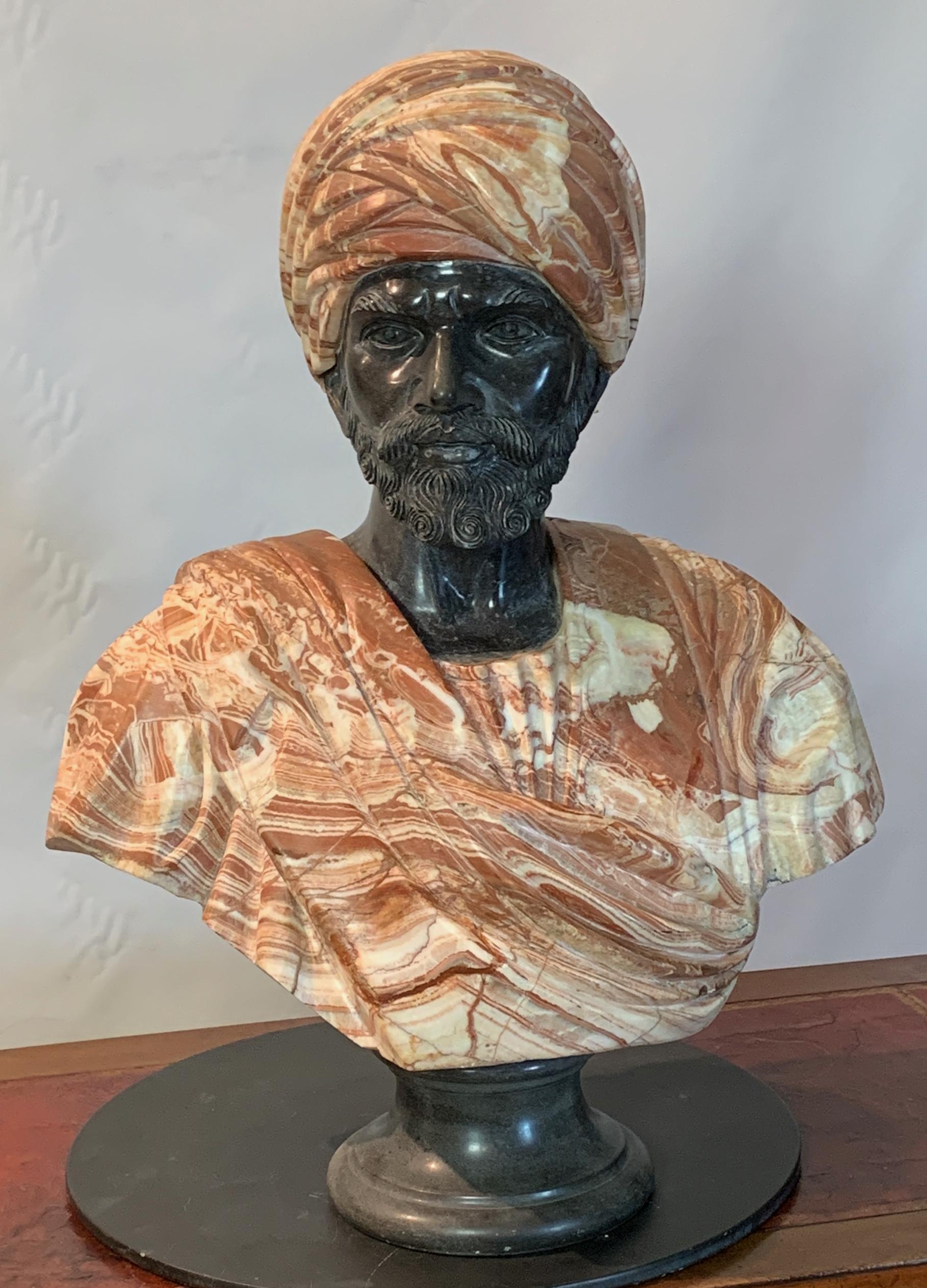 A life-sized marble bust of the Arab Sheikh of Cairo after the 1866 original by Charles Cordier finely modeled in rose and dark gray marble.