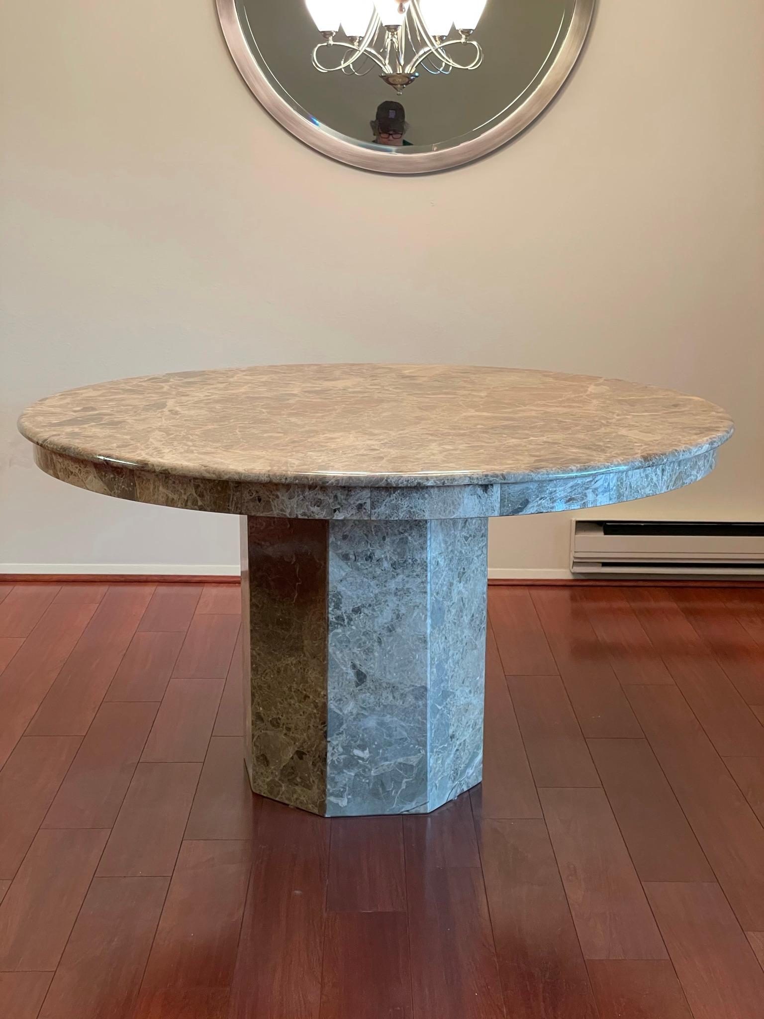 Beautiful natural elegance in this marble dining table. Round top sits on a hexagon base. Great mixed use as either dining or conference table.