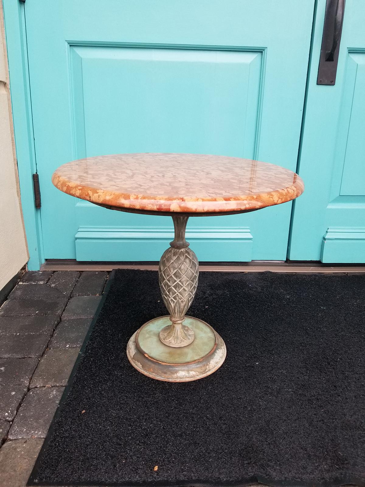 Mid-20th century marble-top table with charming iron pineapple pedestal base.
