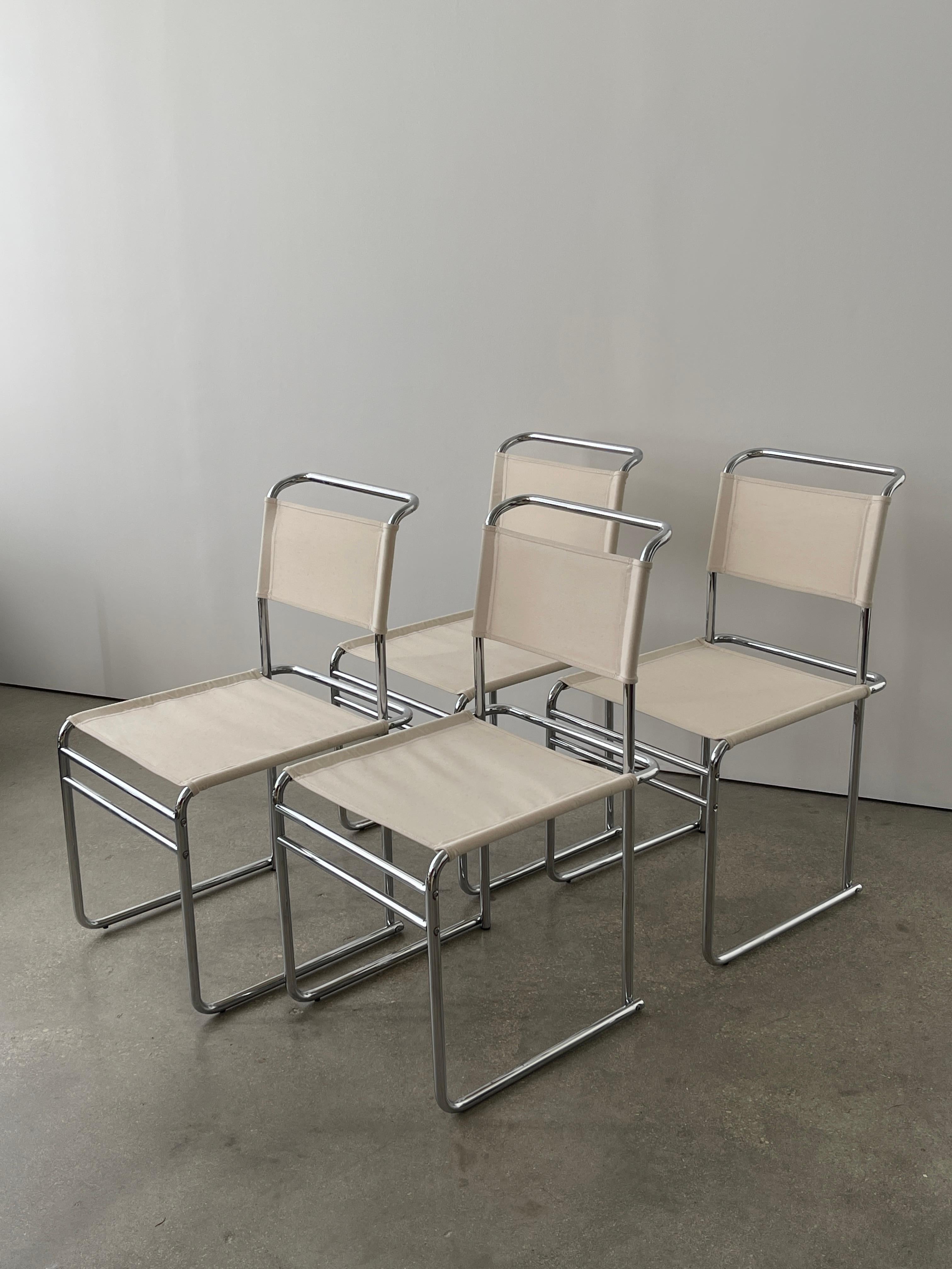 Mid 20th Century Marcel Breuer B5 Chrome and Canvas Chairs set of 4 in a beautiful cream/off white color. Amazing design, light but sturdy and unique. The simplicity of these chairs designed by Marcel Breuer make them such a timeless staple for any