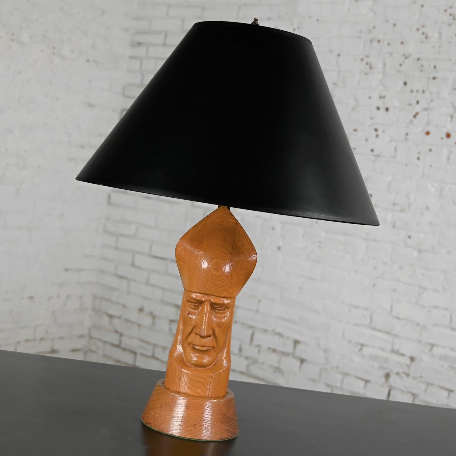 Handsome Mid-20th Century MCM (a.k.a. Mid Century Modern) carved wood Bishop chess piece table lamp with round wood base and tapered black paper tapered shade.  Beautiful condition, keeping in mind that this is vintage and not new so will have signs