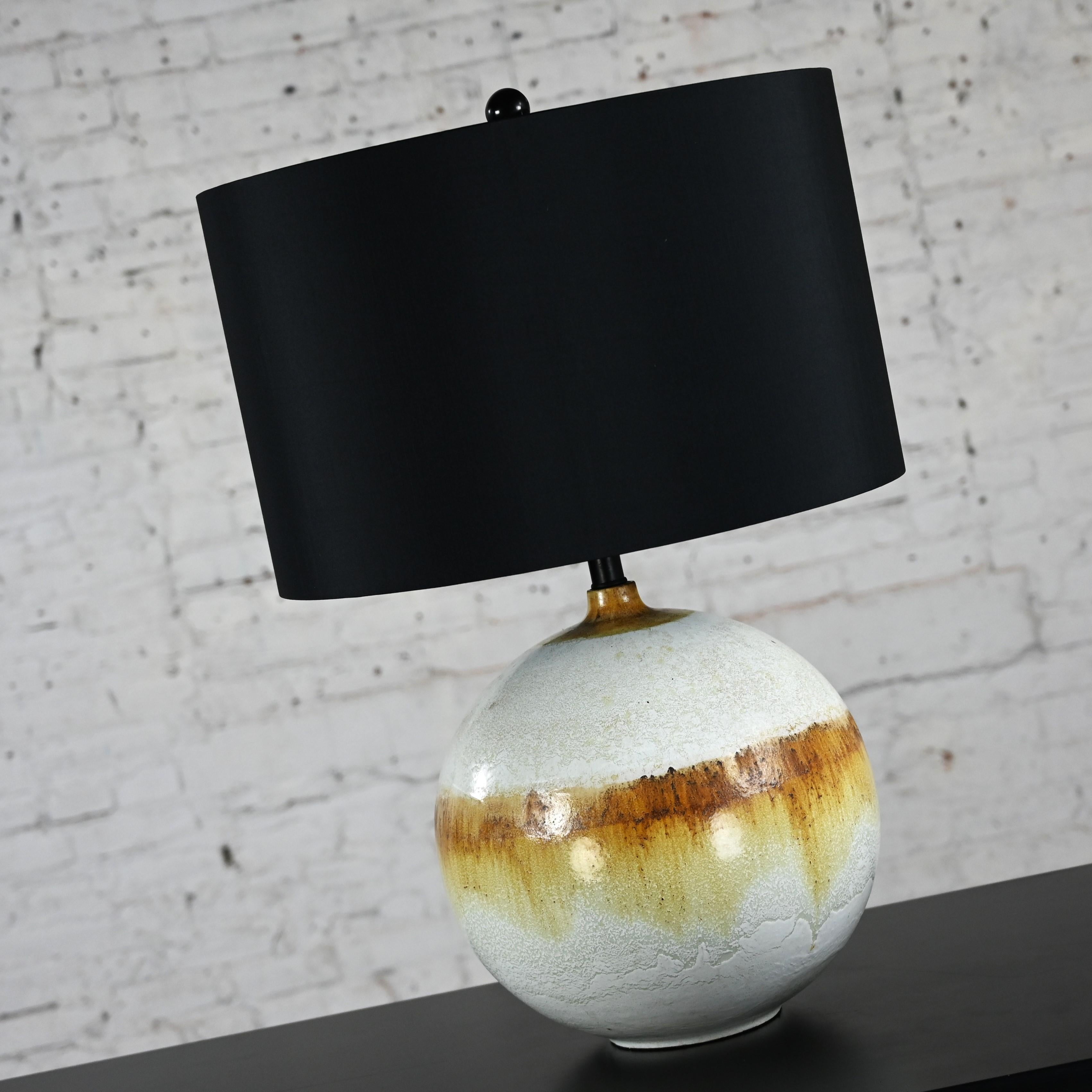 Fabulous vintage Mid-Century Modern drip glaze ceramic ball lamp with a new silk-like black drum shade. Beautiful condition, keeping in mind that this is vintage and not new so will have signs of use and wear even if it has been refinished or