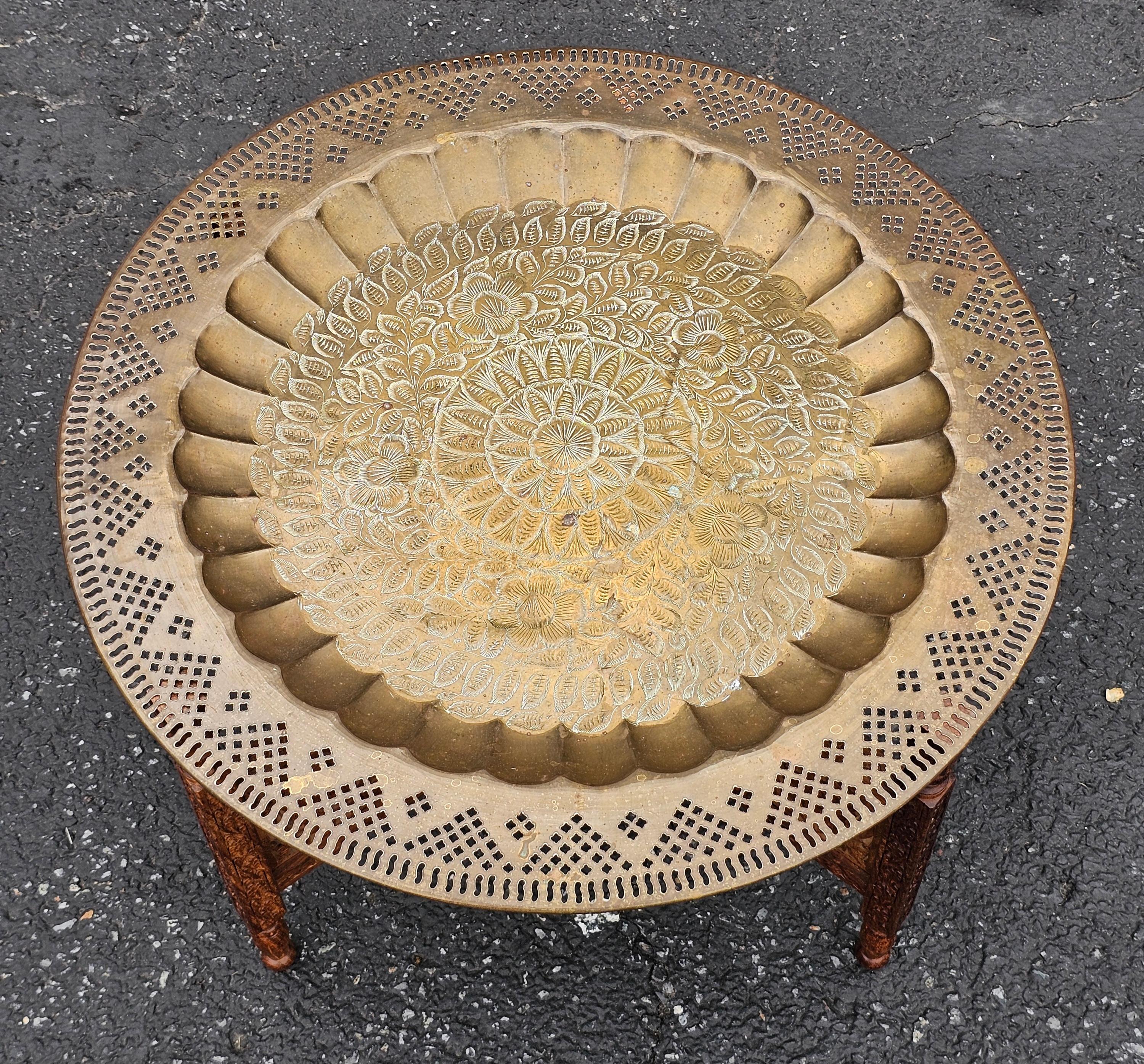 Mid 20th Century Middle Eastern Carved Teak and Etched Brass Folding Tray Table In Good Condition For Sale In Germantown, MD