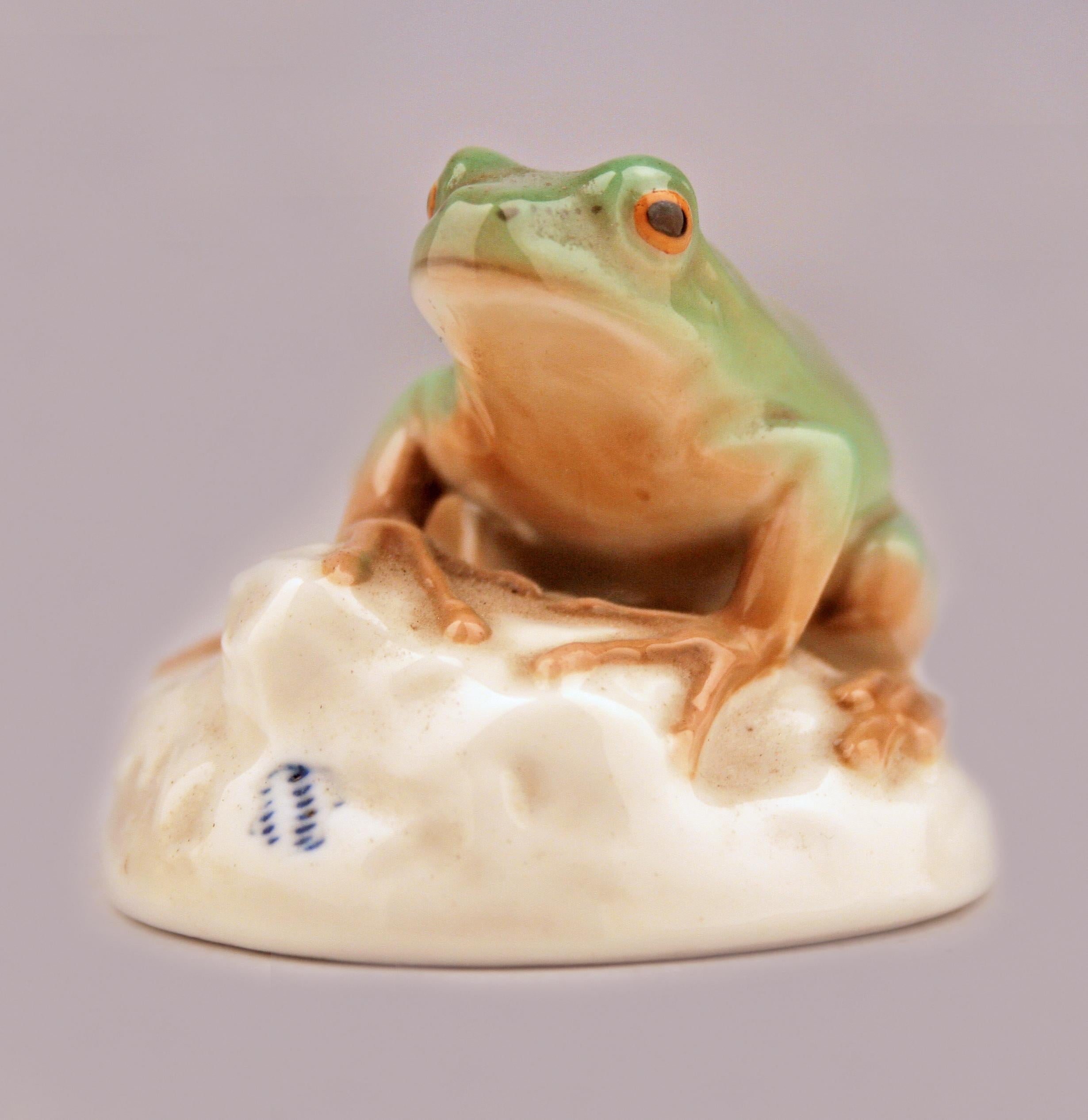 Mid-20th century modern german glazed and painted porcelain frog sitting on a rock by manufacturer Nymphenburg

By: Nymphenburg Porcelain
Material: porcelain, paint, ceramic
Technique: glazed, hand-painted, pressed, molded, painted
Dimensions: 3 in
