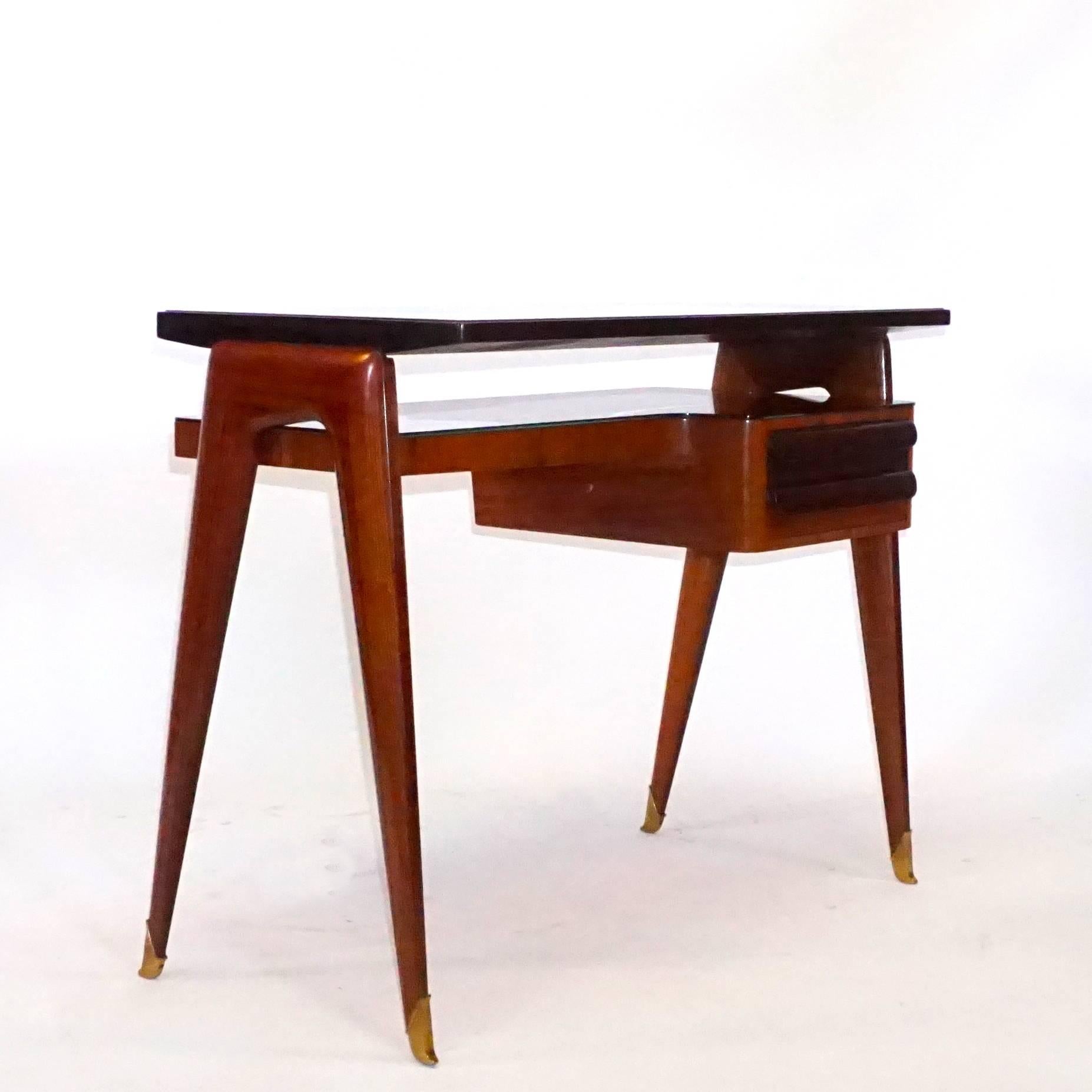 An Italian Vittorio Dassi elegant lady’s writing desk made of Rosewood with patinated brass sabots with two drawers in shellac polish, very good condition. Wear consistent with age and use. Circa 1940 – 1950, Italy.

Vittorio Dassi was an Italian