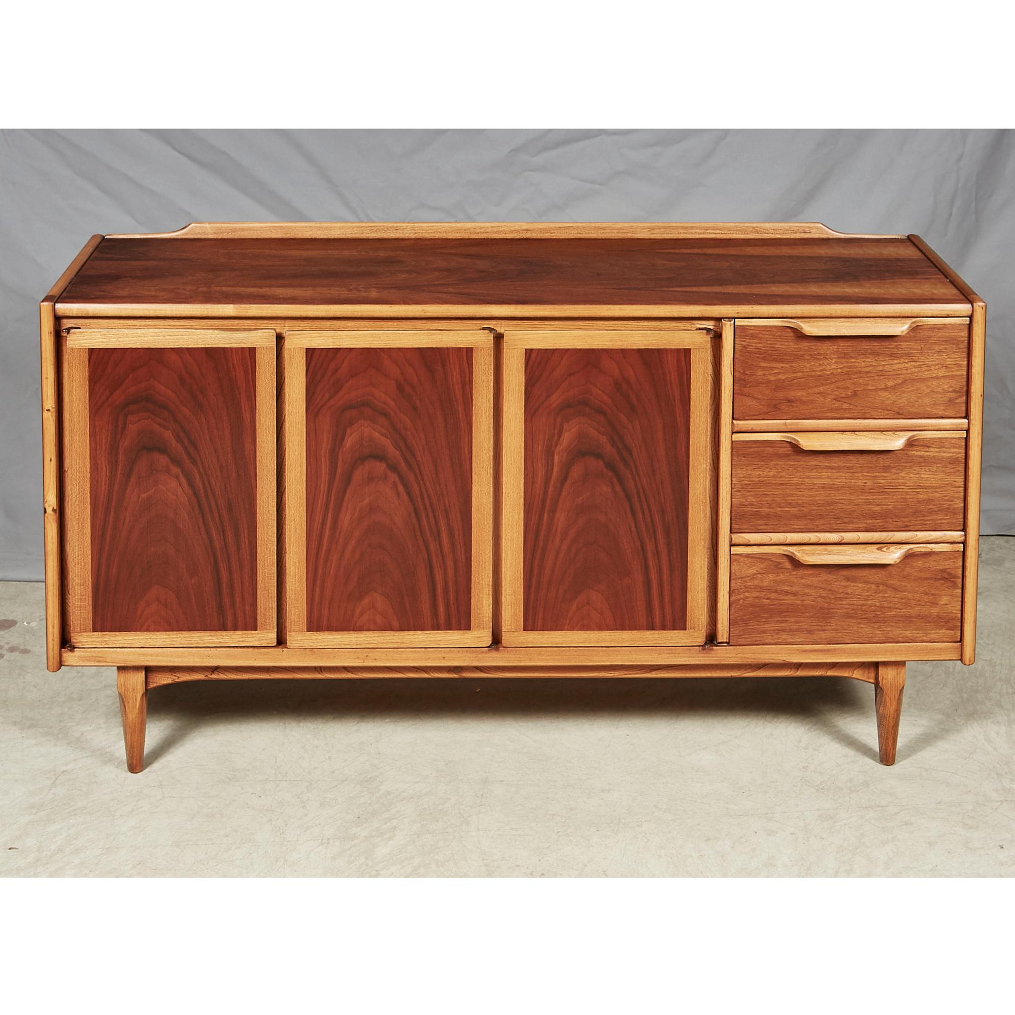 Vintage 1960s walnut and ash wood credenza designed by Lane Furniture Co. The credenza has three drawers and shelving for storage. Fully restored and in excellent condition.