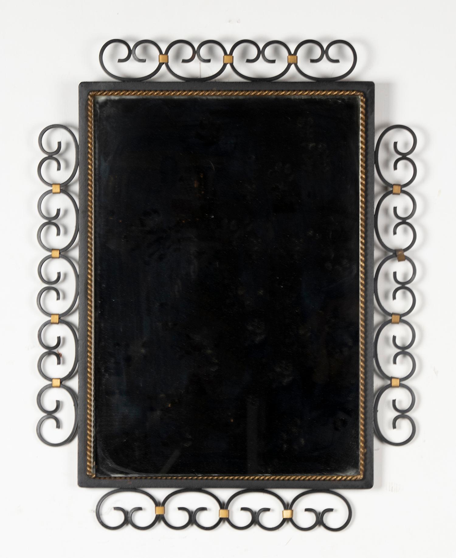 Beautiful Mid-Century Modern mirror, with a frame made of wrought iron. The mirror comes from France, dated circa 1950-1960.
