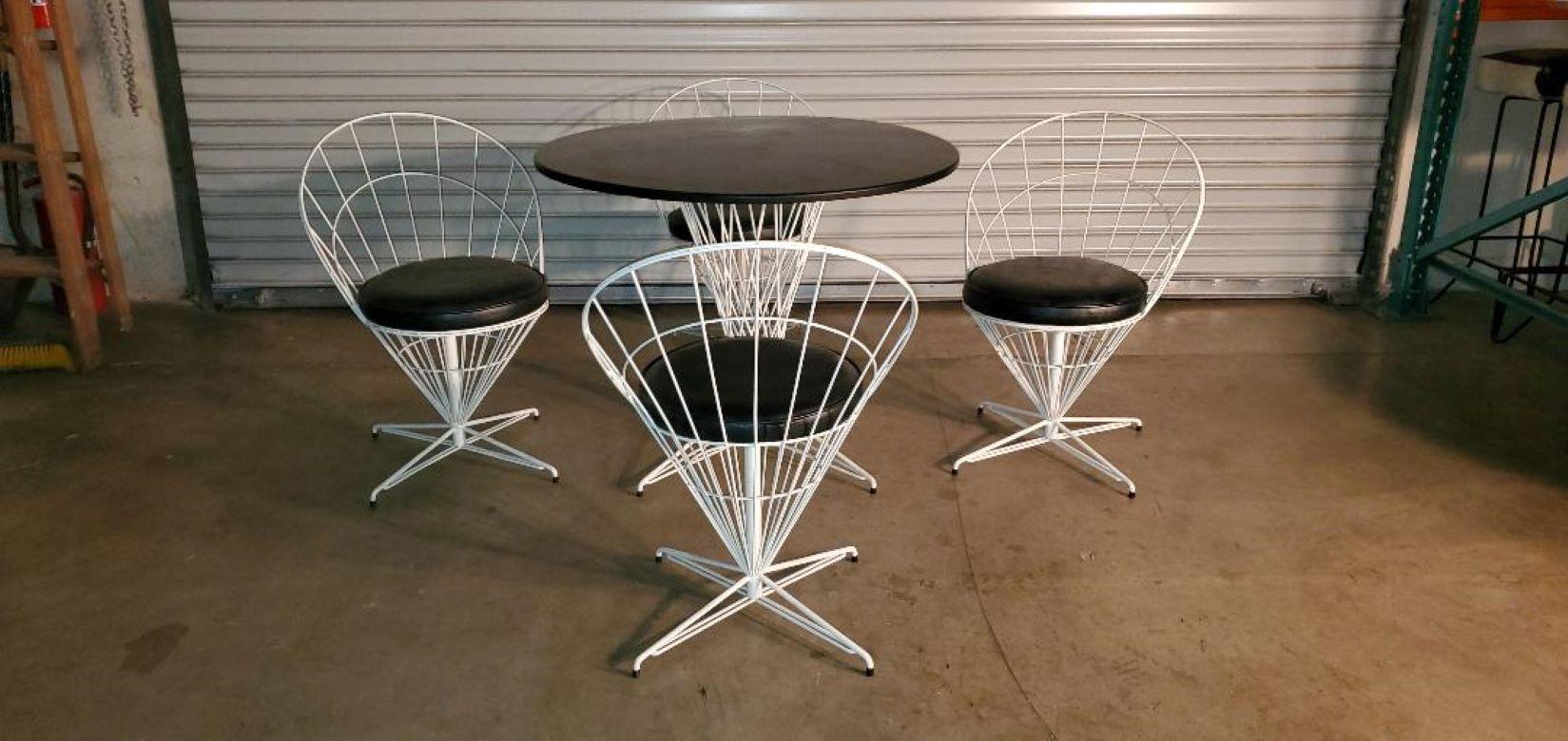 Vintage Mid-Century Modern 5 Piece Open Metal Wire Cone dining set In The Style Or Likeness of Verner Panton.

This 5 Piece White And Black Open Metal Wire Cone Dining Set Is In Excellent Vintage Condition. Four White Open Metal Wire Cone Swivel