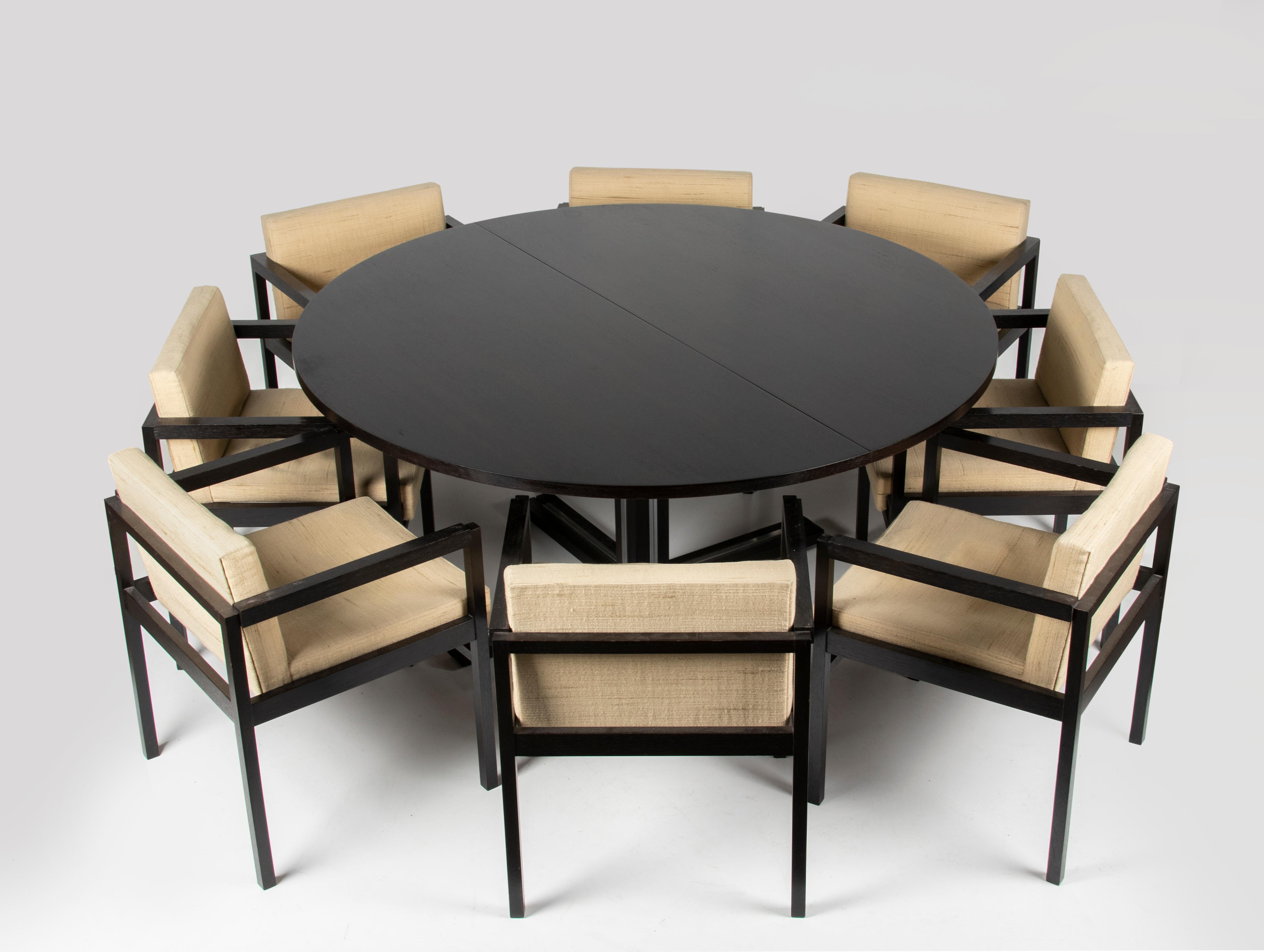 Beautiful large round wenge dining table with 8 matching chairs. The table can be extended with two original intermediate leaves.
If there are 6 chairs at the table, everyone is more spacious. The 8 chairs are especially useful when the table is