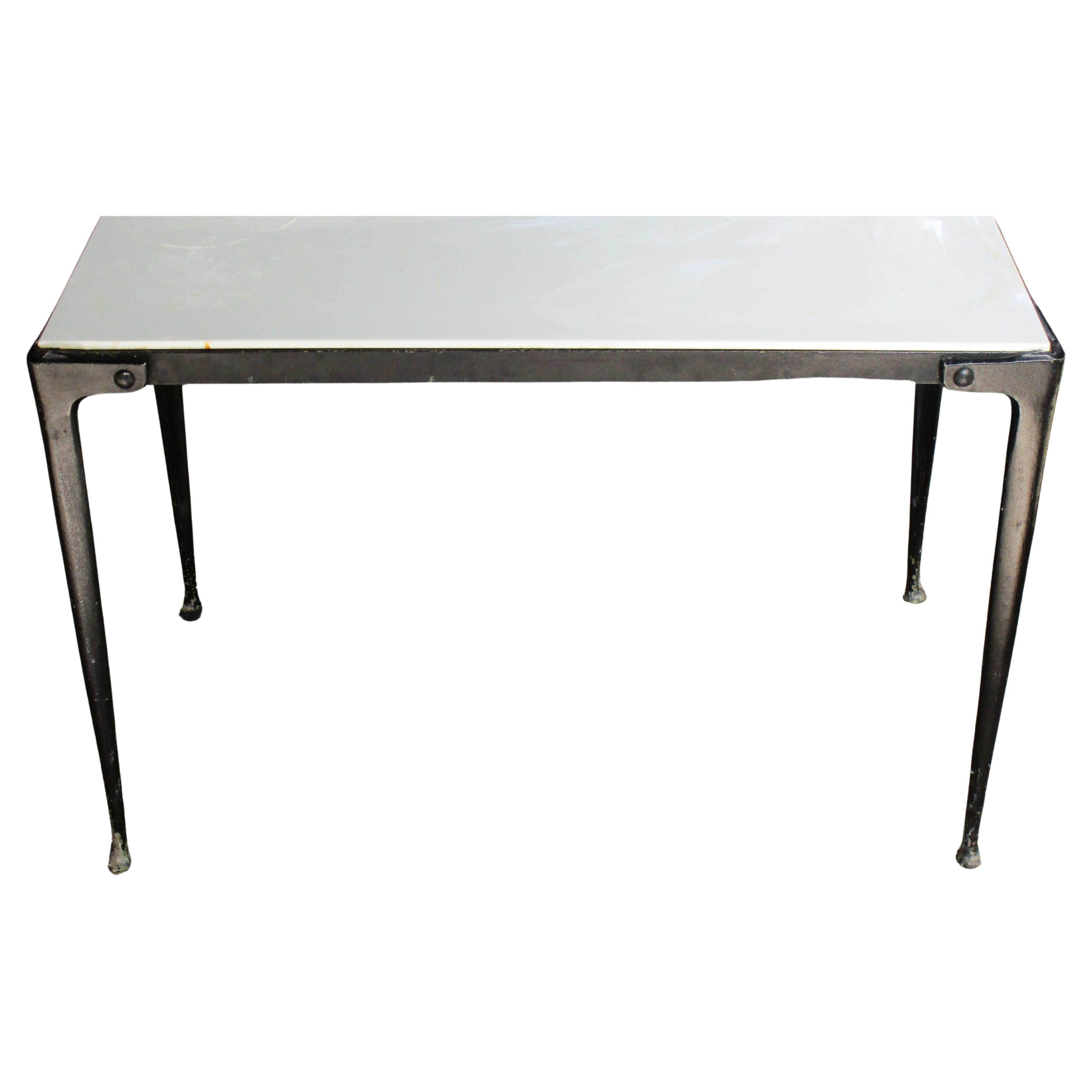 Modernist black enameled aluminum table w/ sleek rivet bolt decorated legs / pad feet / white vitrolite top. Use as coffee table or side table. Great looking minimalist design. Measures 28 3/4