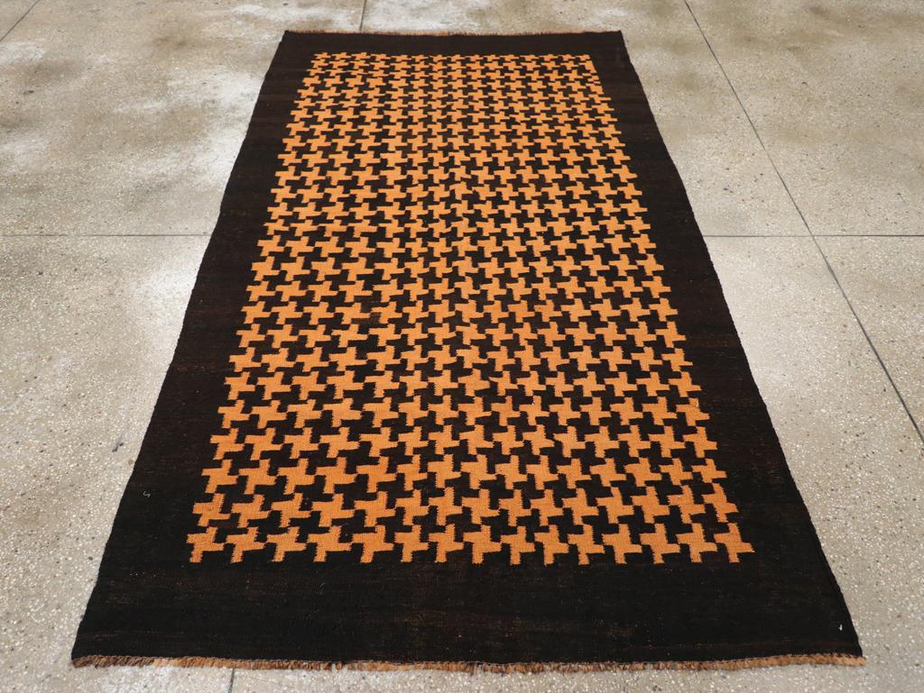 This Mid-20th century Moroccan Flatweave Kilim rug, measuring 4' 9