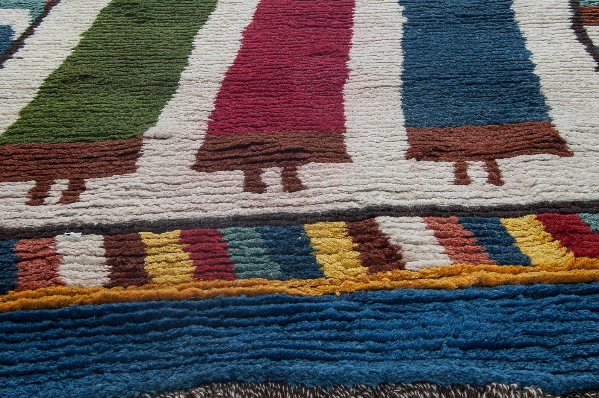 Mid-20th century Moroccan red, green, yellow and navy blue handmade wool rug
Size: 5'7
