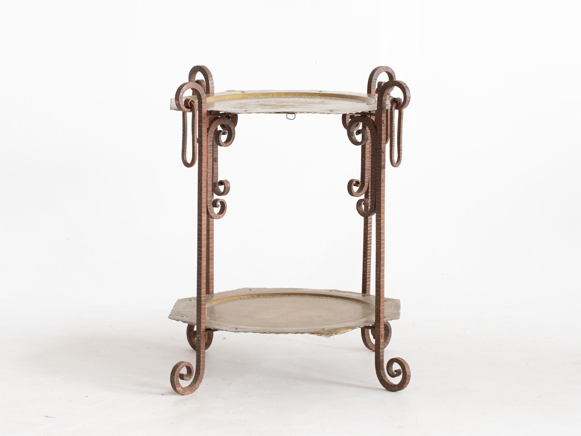 A forged iron and hammered brass tray table. Moroccan, early-mid 20C.

Stock ref. #2243

In good sturdy order with patinated surface. Folds away when not in use.

65 x 50 x 50 cm

25.6 x 19.7 x 19.7 