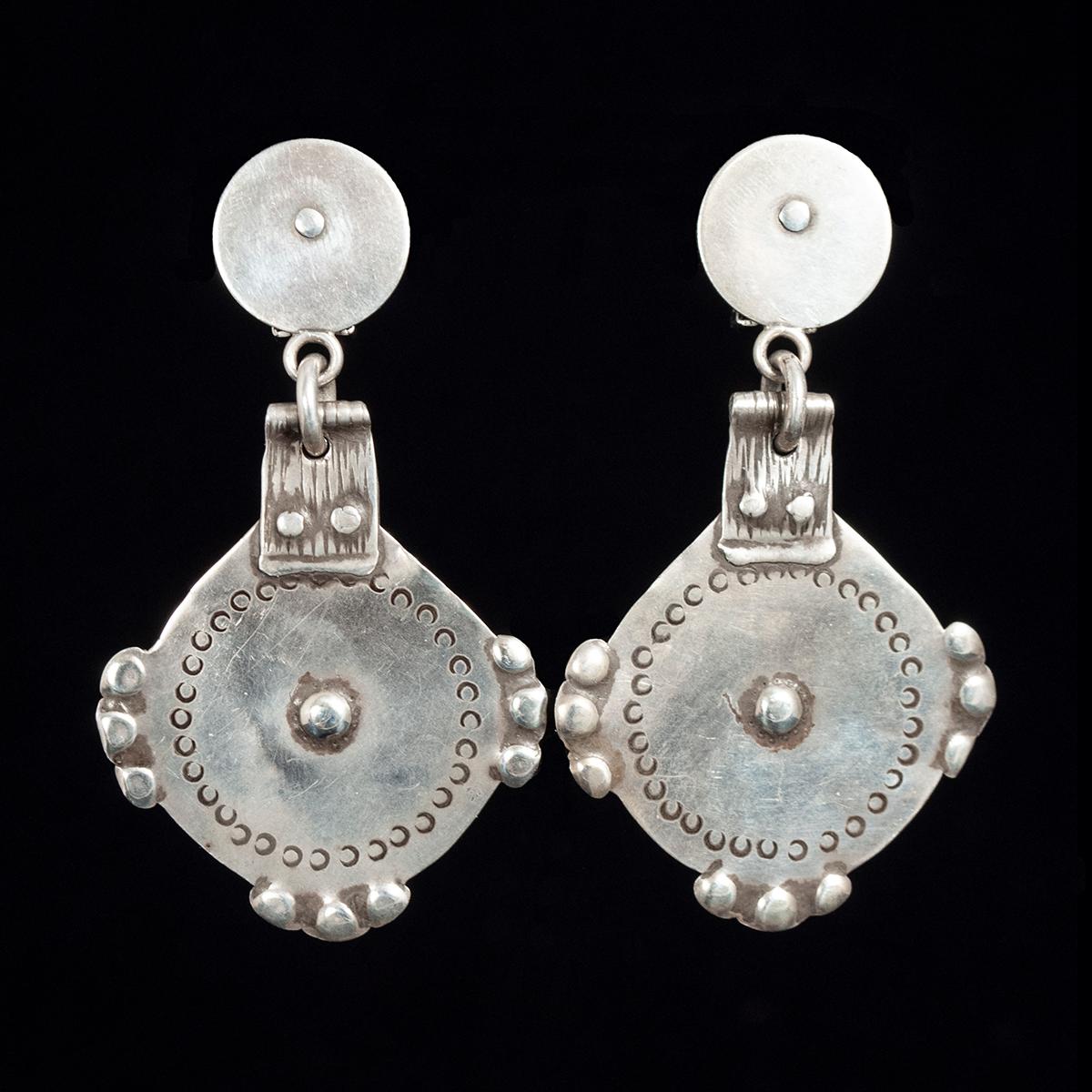 Mid-20th Century Moroccan Silver Charm earrings by Jewels of Santa Fe/Marrakesh

A pair of earrings made by Jewels with rare silver charms from the Ida ou Nadif people living in the Anti-Atlas Mountains of Morocco.
They are 3 inches long, 1.75
