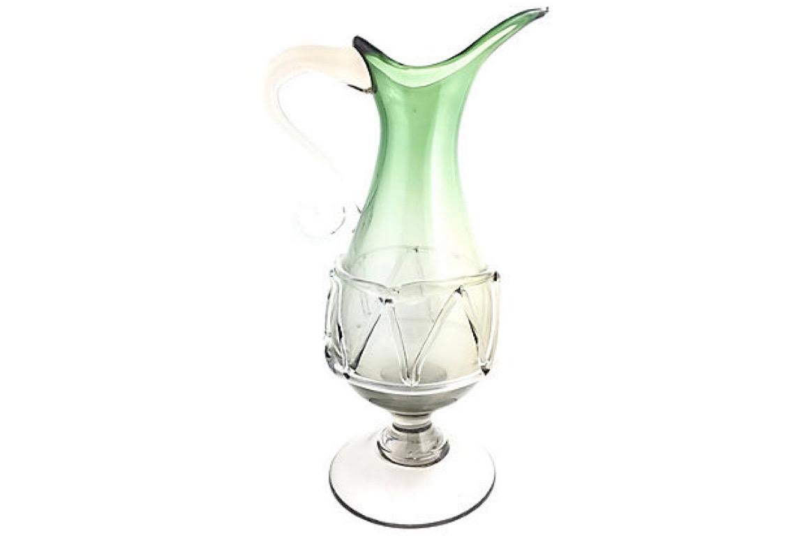 Midcentury Murano art glass pitcher in green that fades from gray to clear with an applied clear glass handle. Air bubbles throughout.