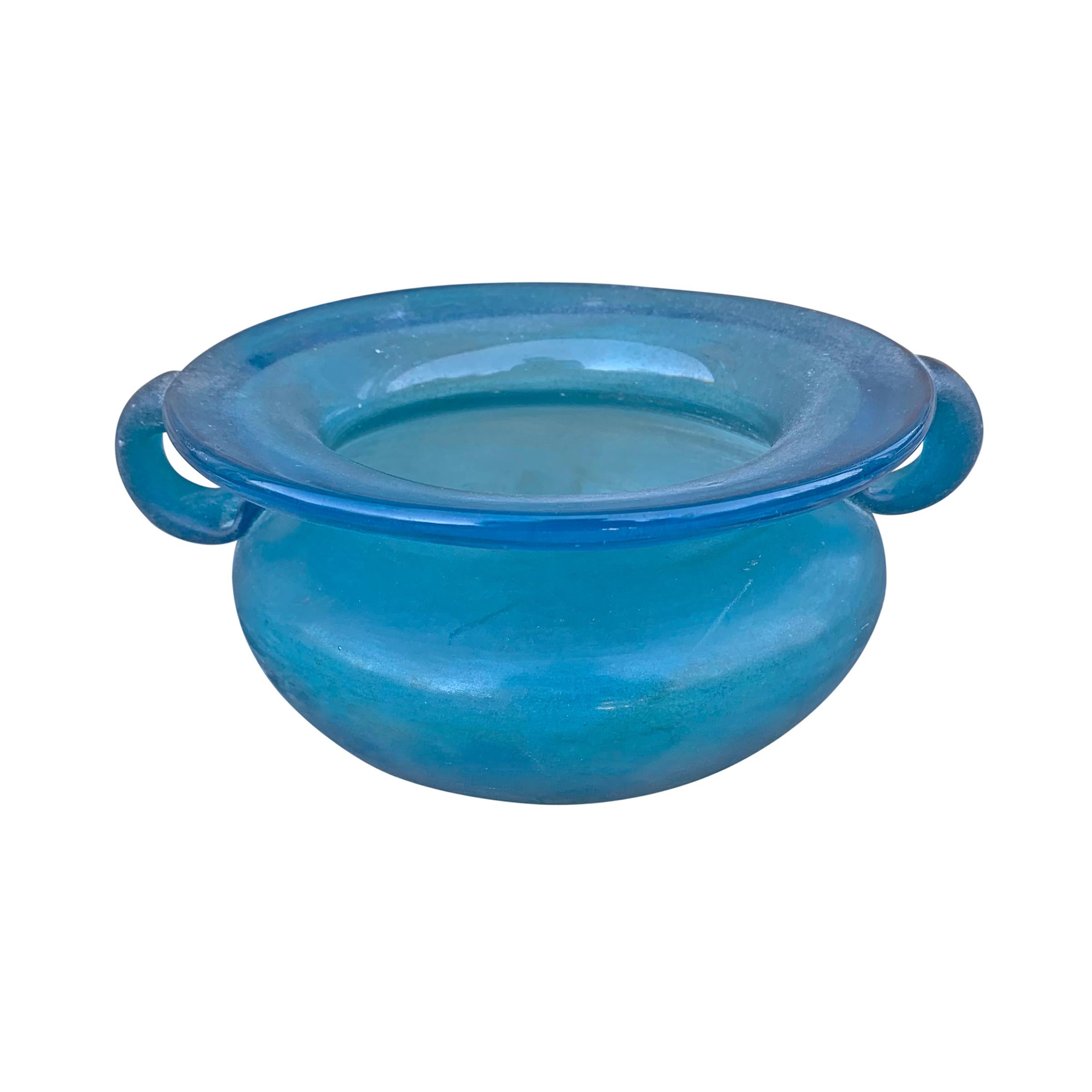 A wonderful mid-20th century Italian Murano blue scavo glass bowl with an ovoid form and two handles. 