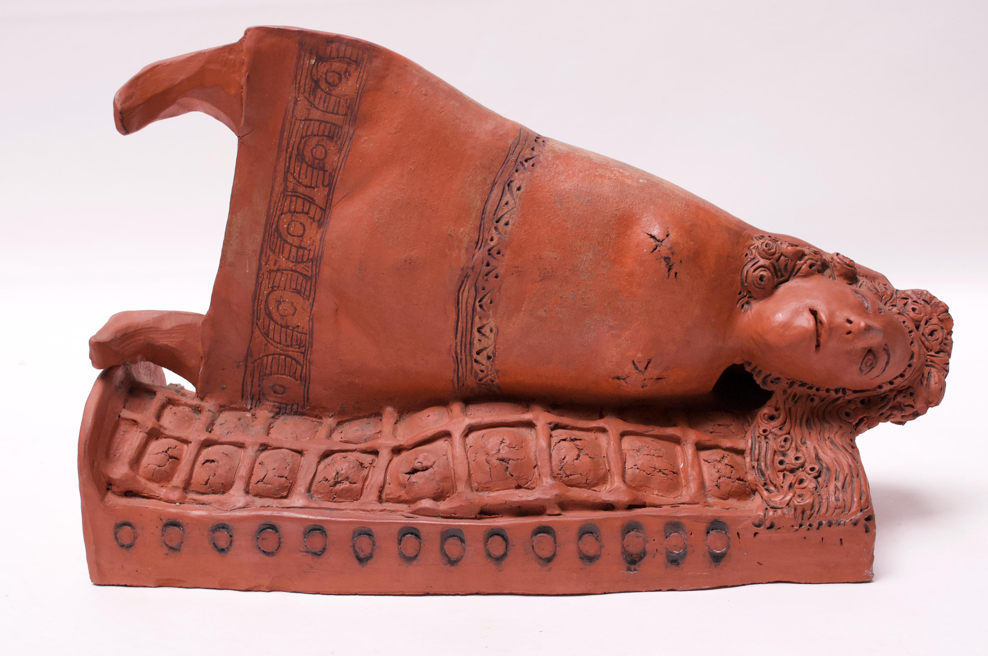 Sculpture depicting a female, armless figure lying on her side, circa 1960s-1970s. Unsure of the subject, but the style and details of the hair suggest this could depict Medusa.
Impressive, dense piece measuring: H 10.75