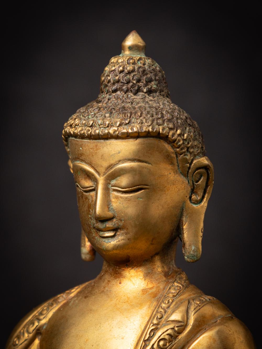 Mid-20th century old bronze Nepali Buddha statue in Varada Mudra 5
