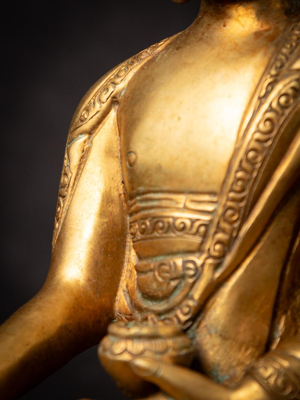 Mid-20th century old bronze Nepali Buddha statue in Varada Mudra 6