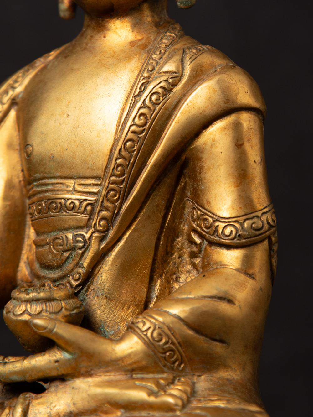 Mid-20th century old bronze Nepali Buddha statue in Varada Mudra 7