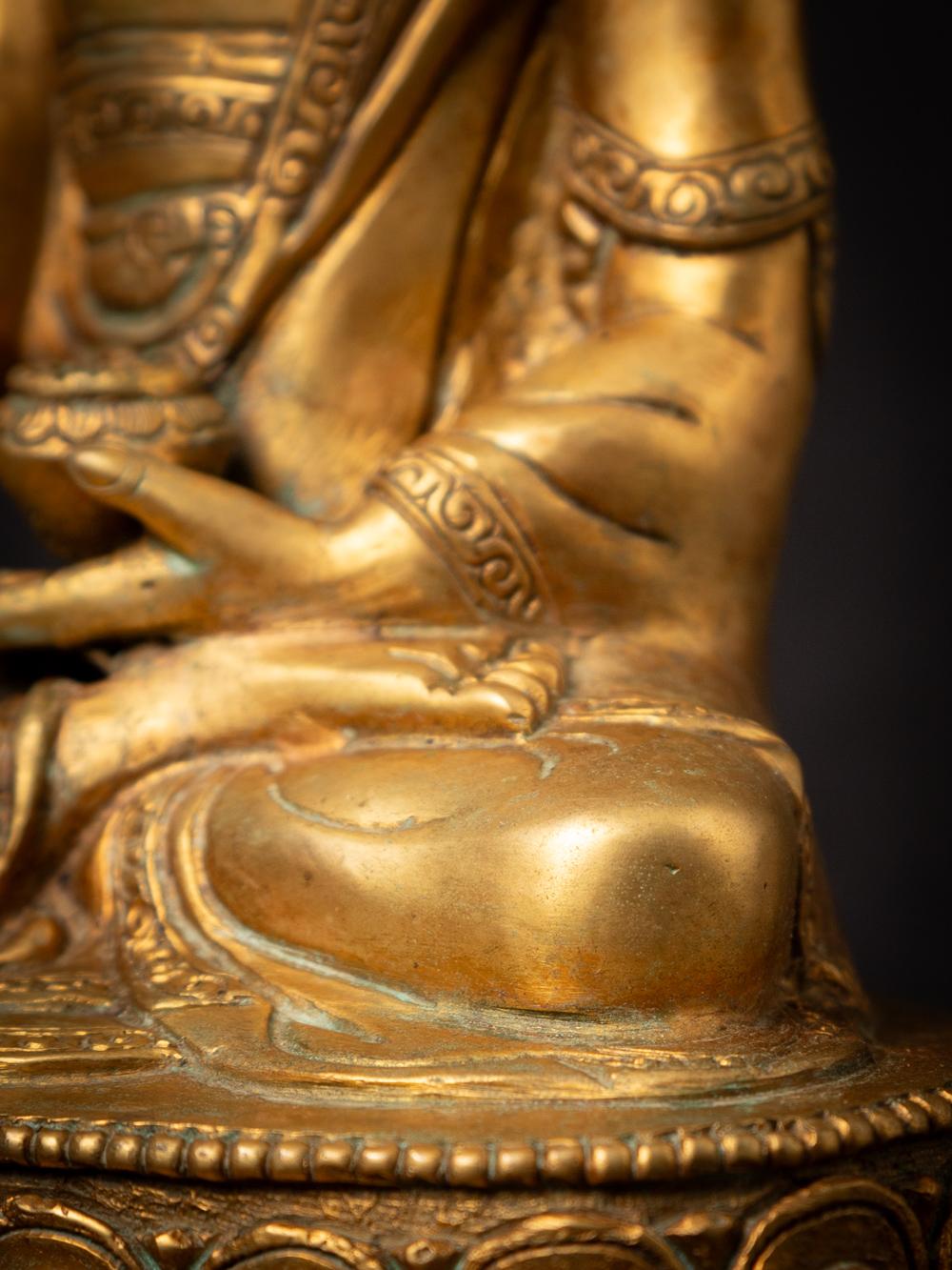 Mid-20th century old bronze Nepali Buddha statue in Varada Mudra 10